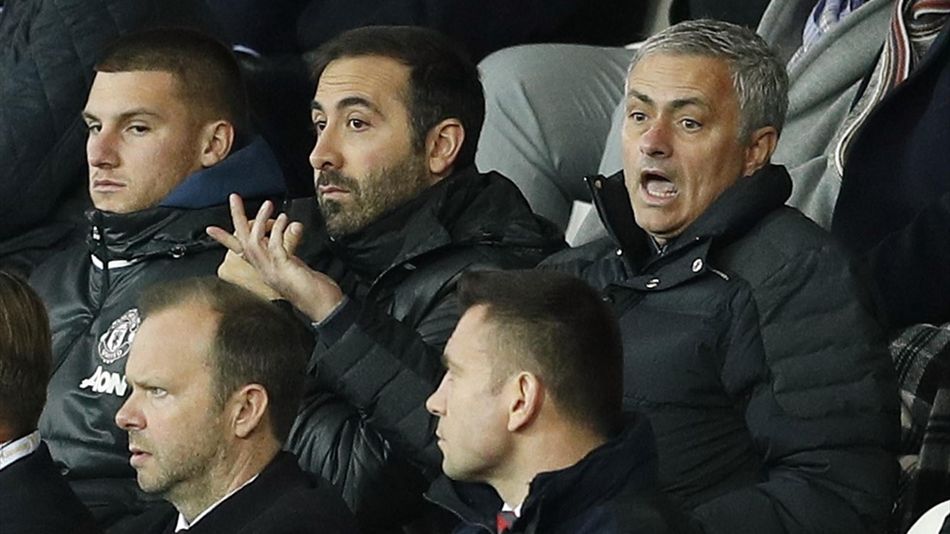 Manchester United boss Jose Mourinho gesticulates wildly behind Ed Woodward