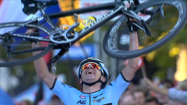 Victorious Evenepoel stops on finish line, lifts bike above his head Victorious Evenepoel stops on finish line, lifts bike above his head