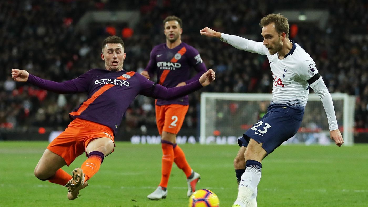 Christian Eriksen is denied by the flailing leg from Aymeric Laporte