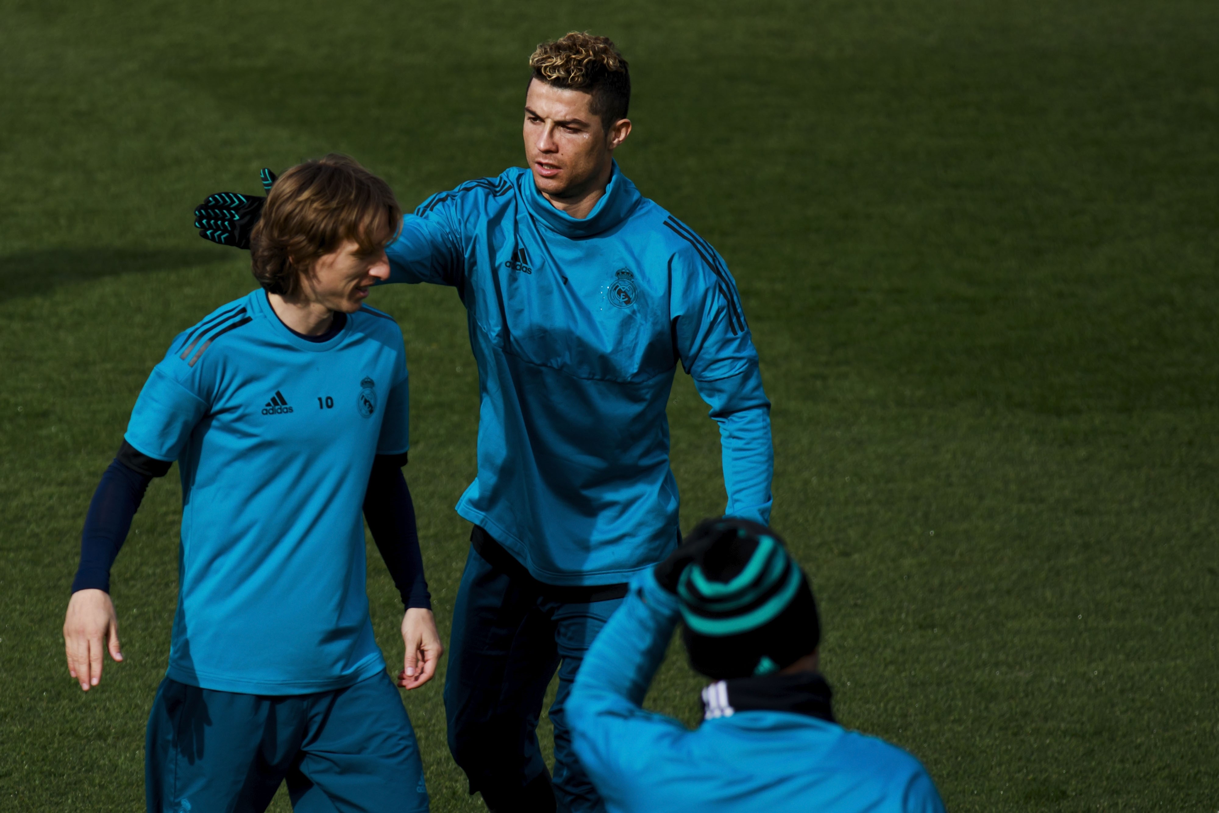 Cristiano Ronaldo (R) of Real Madrid CF jokes with his teammate Luka Modric (L)
