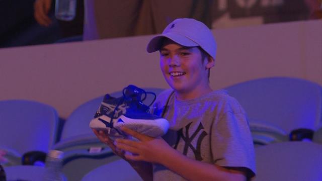 Djokovic gives his shoes to an excited young fan Djokovic gives his shoes to an excited young fan