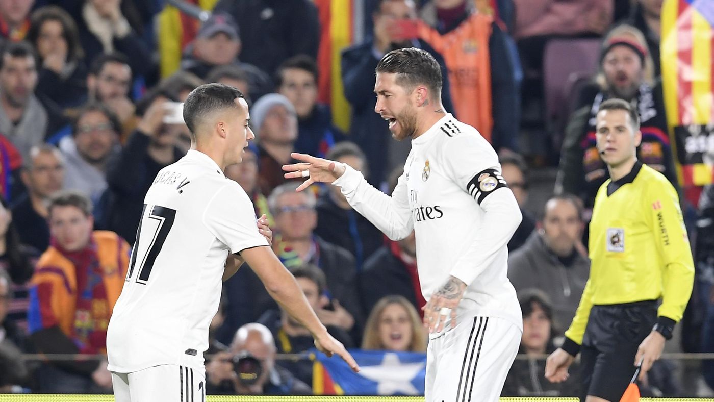 Real Madrid's Spanish midfielder Lucas Vazquez (L) celebrate with Real Madrid's Spanish defender Sergio Ramos after scoring during the Spanish Copa del Rey (King's Cup) semi-final first leg football match between FC Barcelona and Real Madrid CF at the Cam