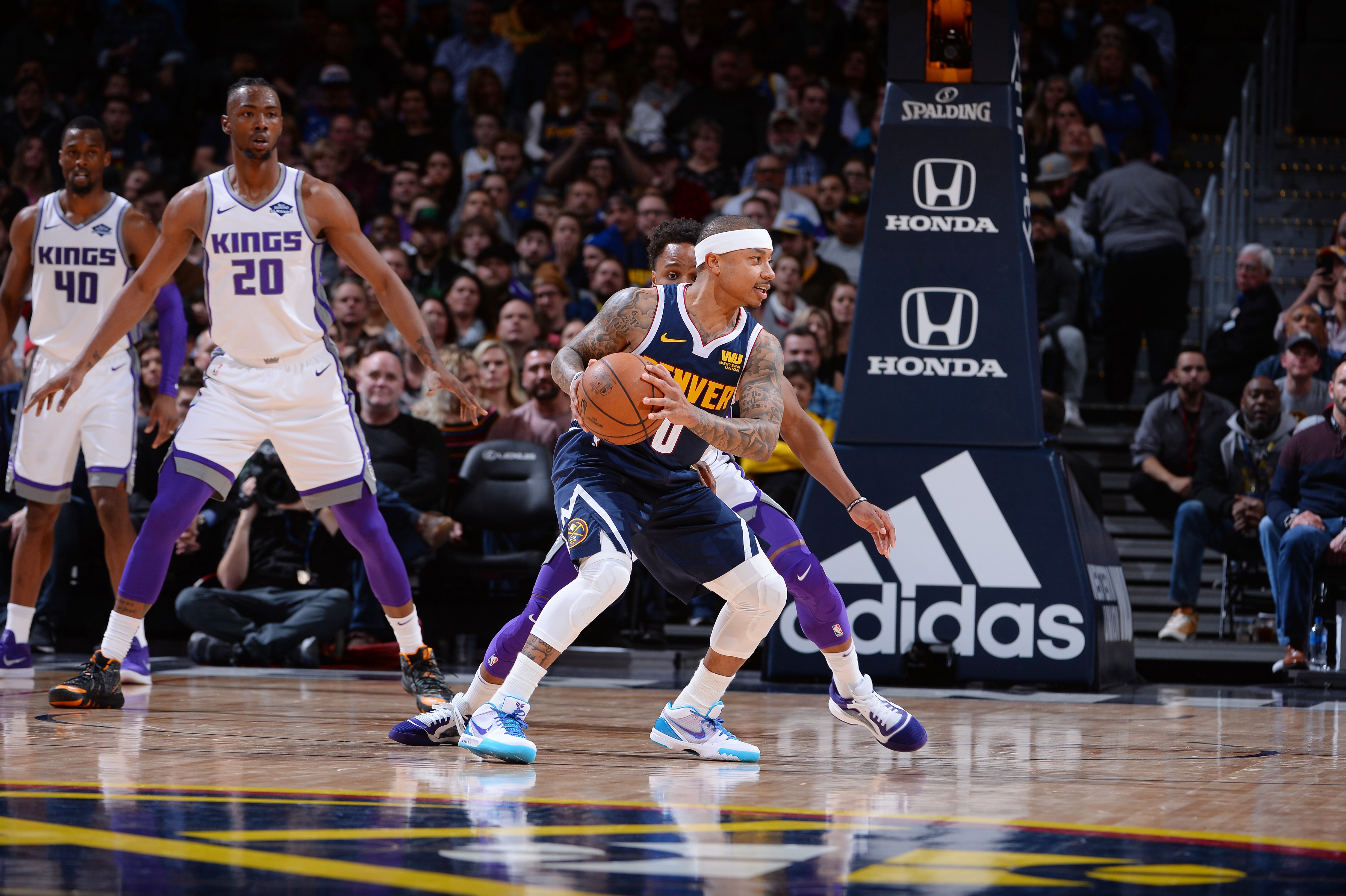 Isaiah Thomas #0 of the Denver Nuggets handles the ball against the Sacramento Kings on February 13, 2019 at the Pepsi Center in Denver