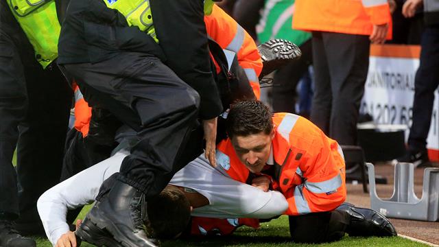 Arrests made after pitch invasions at Bournemouth and Swansea