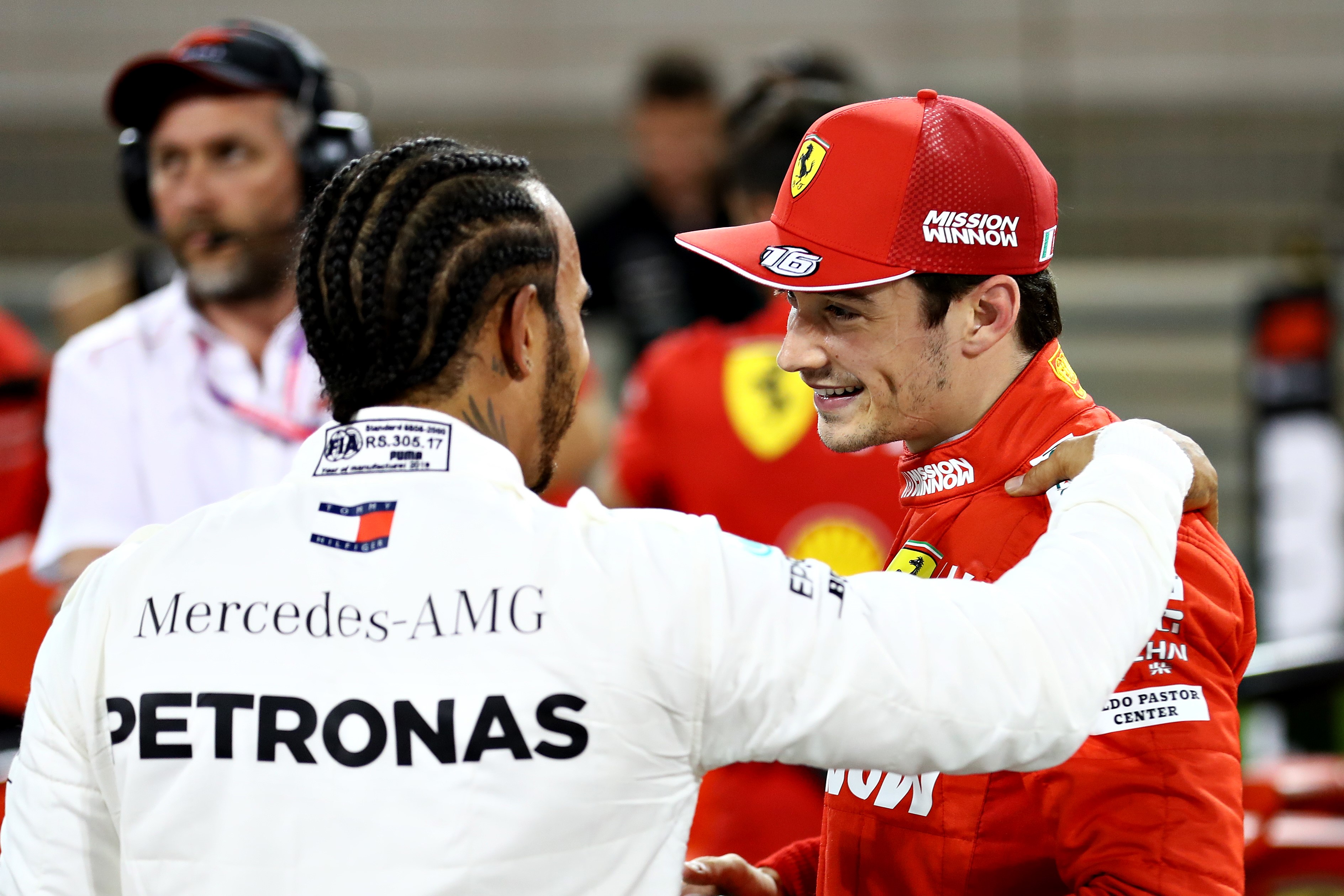 Pole position qualifier Charles Leclerc of Monaco and Ferrari is congratulated by third placed qualifier Lewis Hamilton of Great Britain and Mercedes GP in parc ferme during qualifying for the F1 Grand Prix of Bahrain at Bahrain International Circuit on M