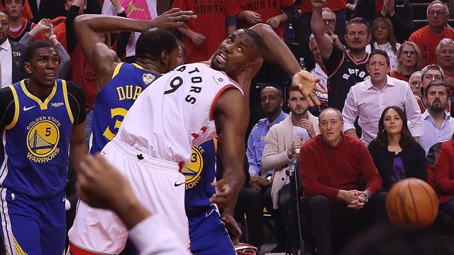Durant exits, but Warriors edge Raptors to stay alive