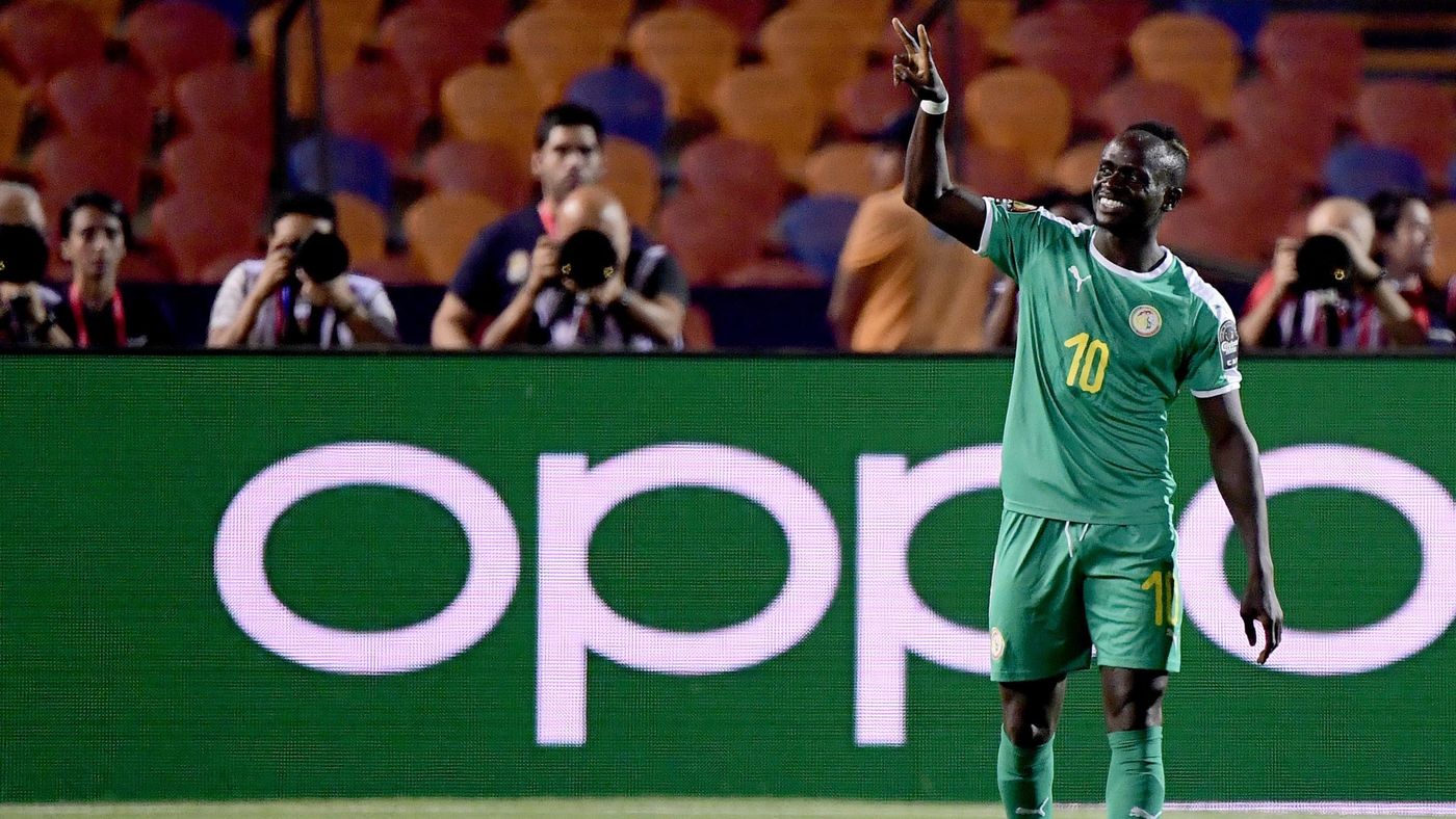 Senegal's forward Sadio Mane flashes the victory gesture as he reacts after scoring a goal during the 2019 Africa Cup of Nations (CAN) Round of 16 football match between Uganda and Senegal at the Cairo International Stadium in the Egyptian capital on July