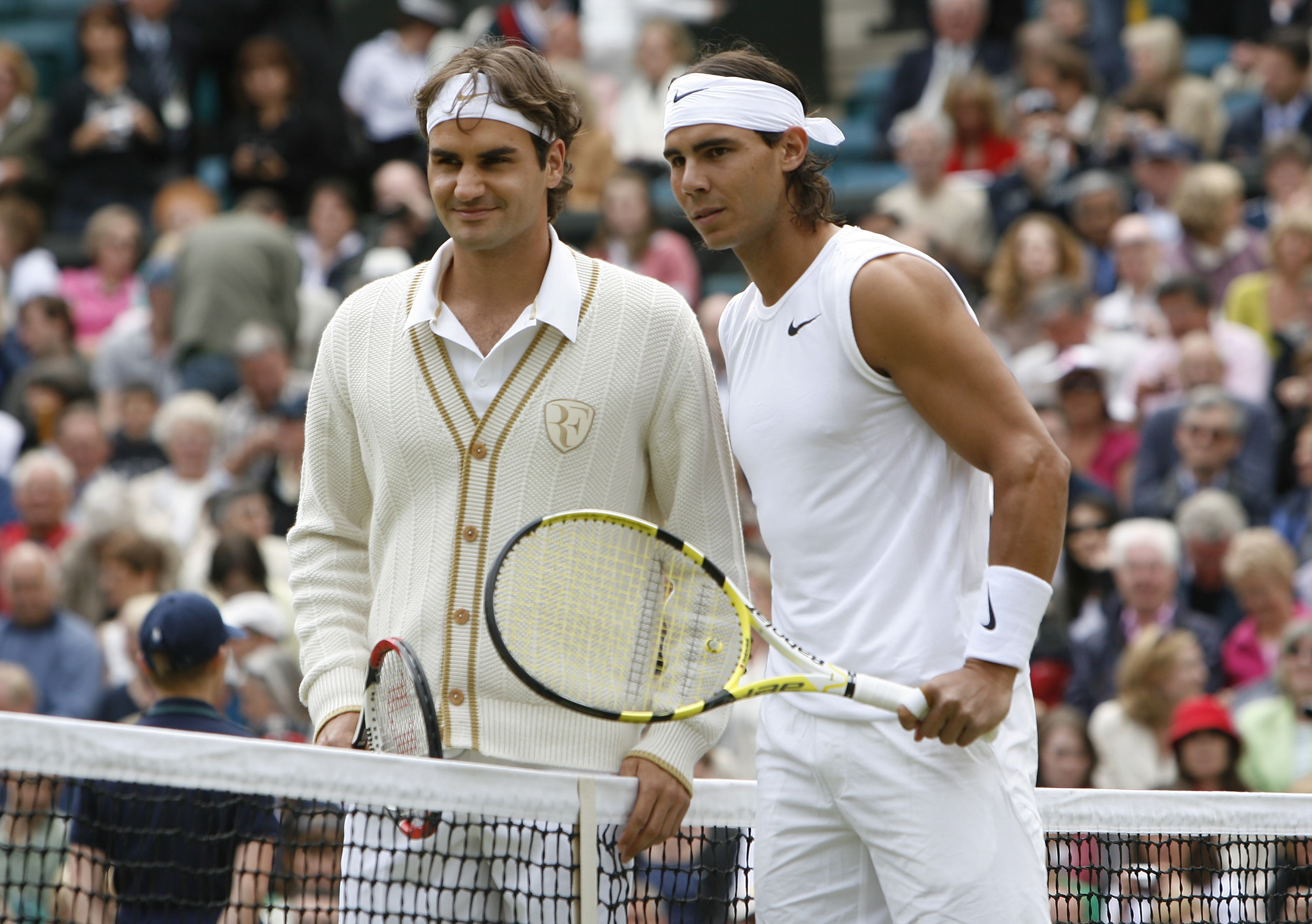 Roger Federer and Rafael Nadal pose for photographs before the Men's Singles Final on Day 13 of the 2008 Wimbledon