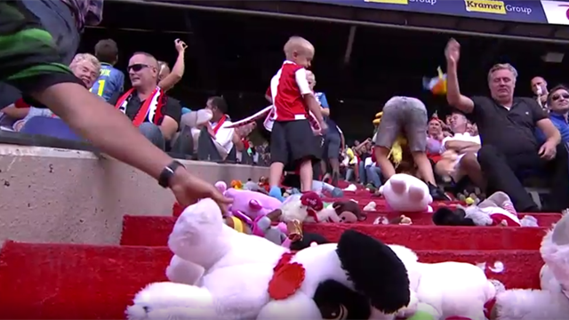 Raining teddy bears! Away fans shower kids with cuddly toys Raining teddy bears! Away fans shower kids with cuddly toys