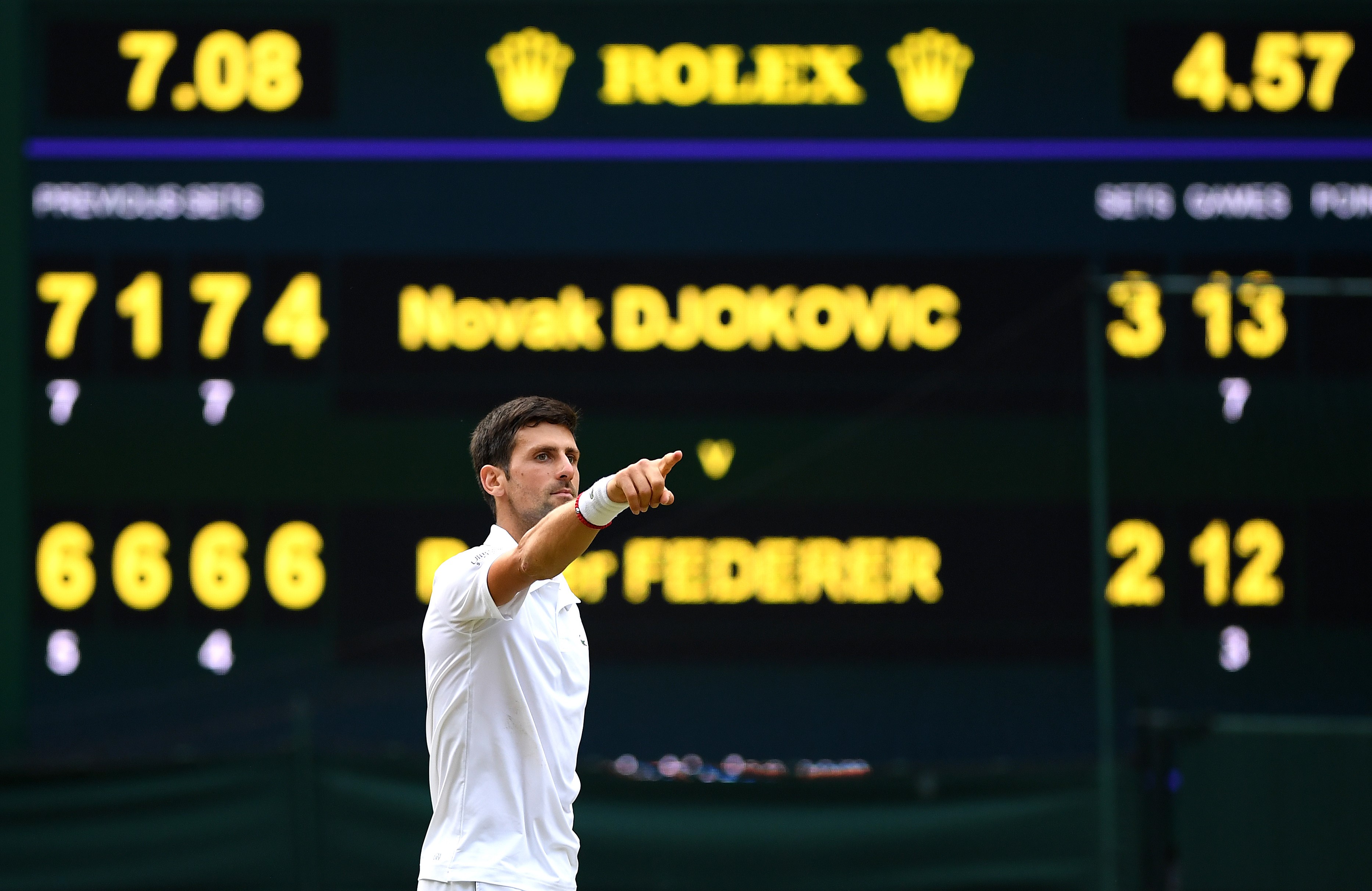 Novak Djokovic of Serbia celebrates winning the Men's Singles final against Roger Federer of Switzerland during Day thirteen of The Championships - Wimbledon 2019 at All England Lawn Tennis and Croquet Club on July 14, 2019 in London, England