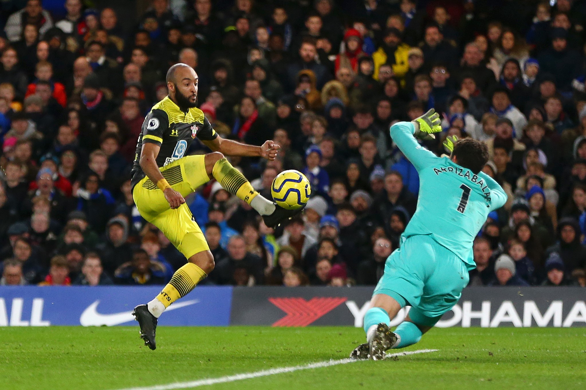 Nathan Redmond of Southampton scores his team's second goal past Kepa Arrizabalaga of Chelsea during the Premier League match between Chelsea FC and Southampton FC at Stamford Bridge on December 26, 2019 in London, United Kingdom.