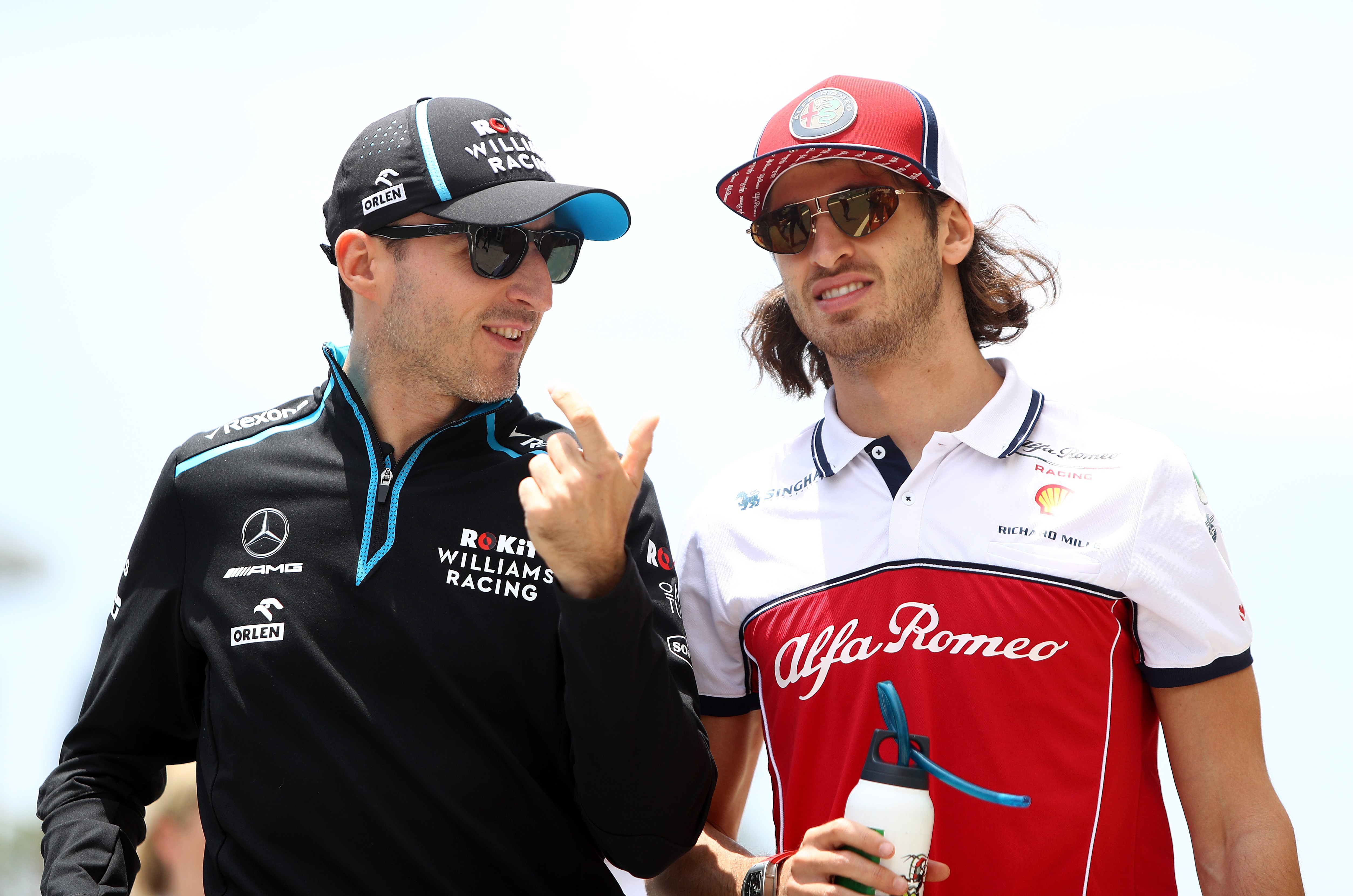 Robert Kubica et Antonio Giovinazzi discutent lors du Grand Prix du Brésil 2019