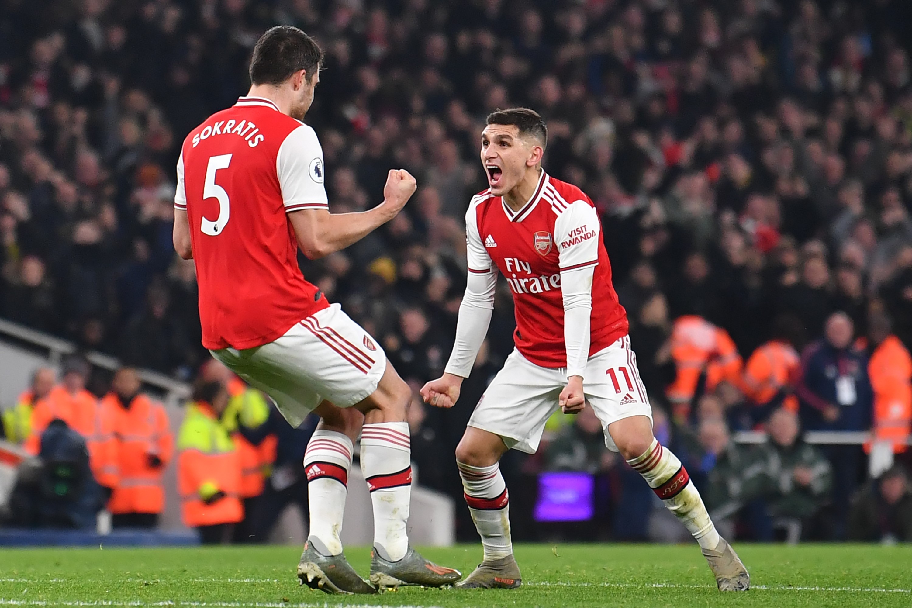 Arsenal's Greek defender Sokratis Papastathopoulos (L) celebrates with Arsenal's Uruguayan midfielder Lucas Torreira (R) after scoring their second go