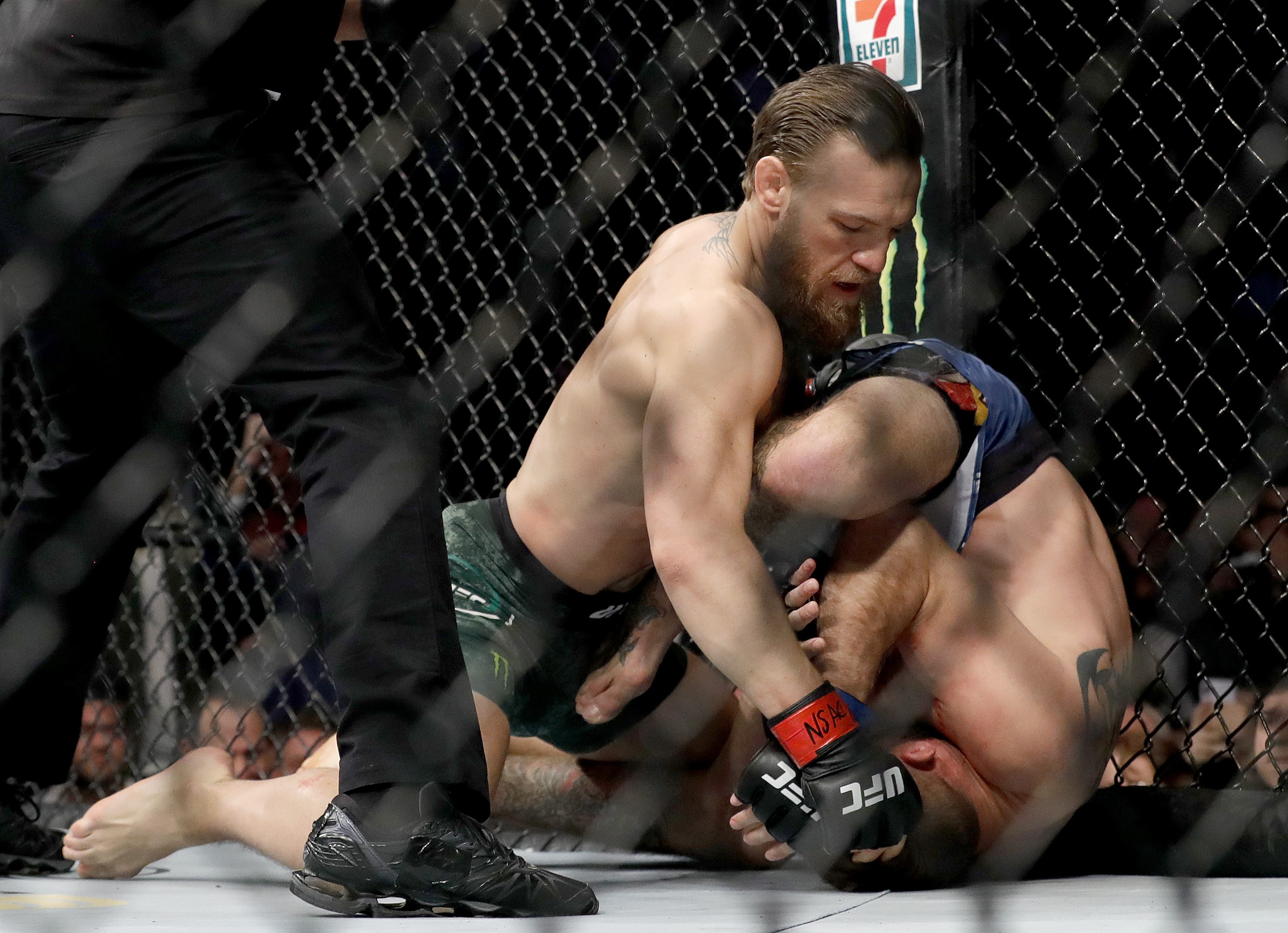 Conor McGregor throws a right against Donald Cerrone in the first round in their welterweight bout during UFC246 at T-Mobile Arena on January 18, 2020 in Las Vegas, Nevada