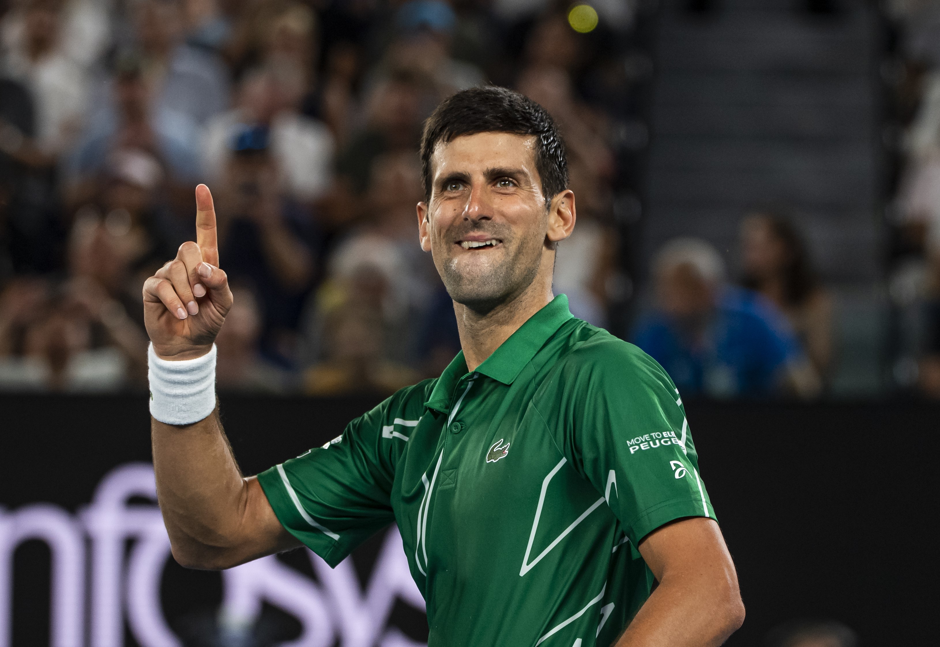 Novak Djokovic of Serbia celebrates his victory over Roger Federer of Switzerland in the semi-final of the men's singles on day eleven of the 2020 Australian Open at Melbourne Park on January 30, 2020 in Melbourne, Australia.