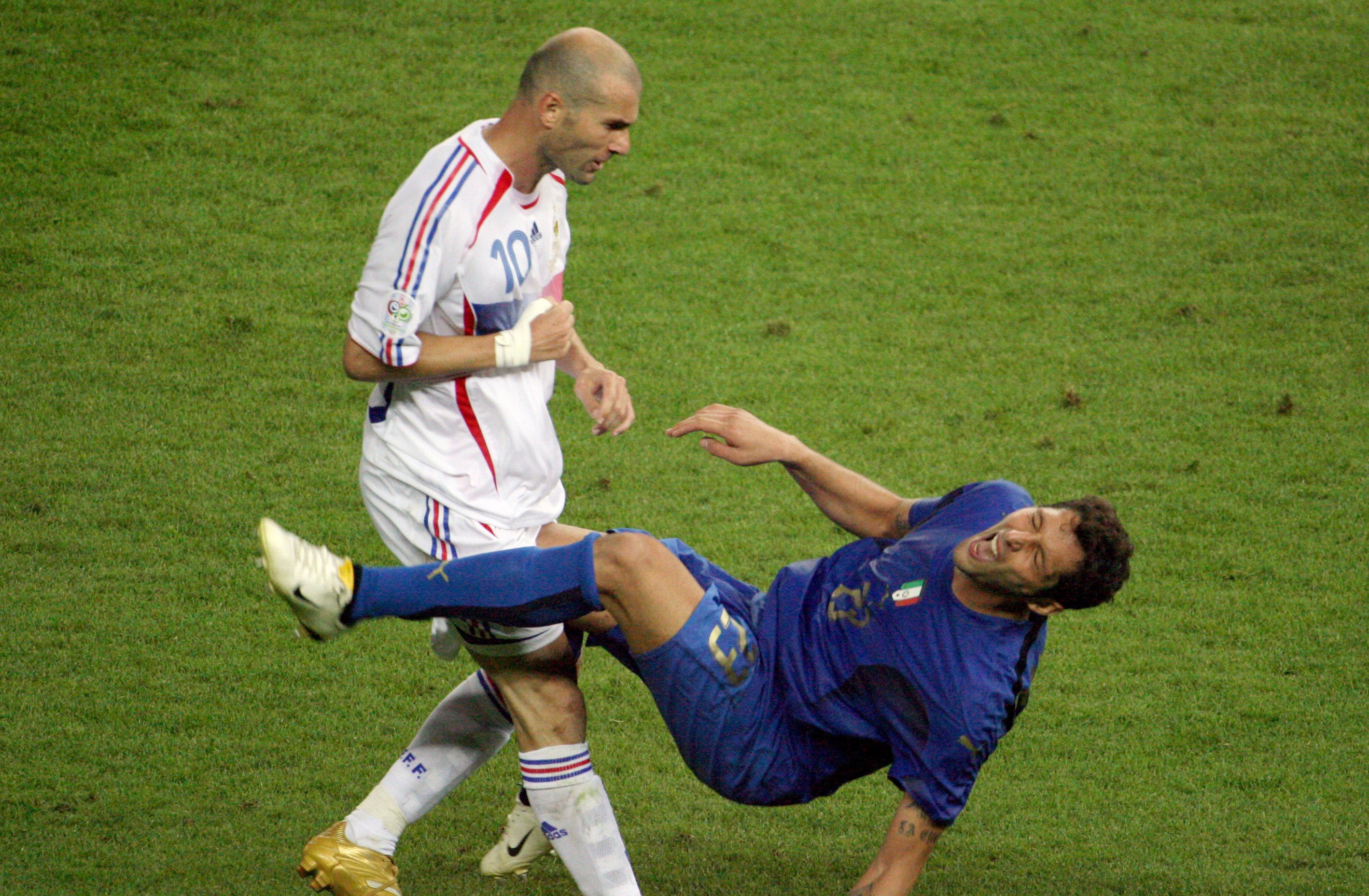 French midfielder Zinedine Zidane (L) gesturing after head-butting Italian defender Marco Materazzi