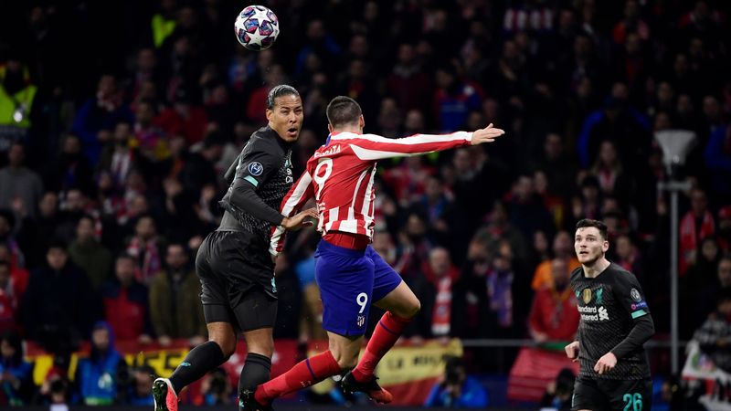 Liverpool's Dutch defender Virgil van Dijk (L) vies with Atletico Madrid's Spanish forward Alvaro Morata during the UEFA Champions League, round of 16, first leg football match between Club Atletico de Madrid and Liverpool FC at the Wanda Metropolitano st