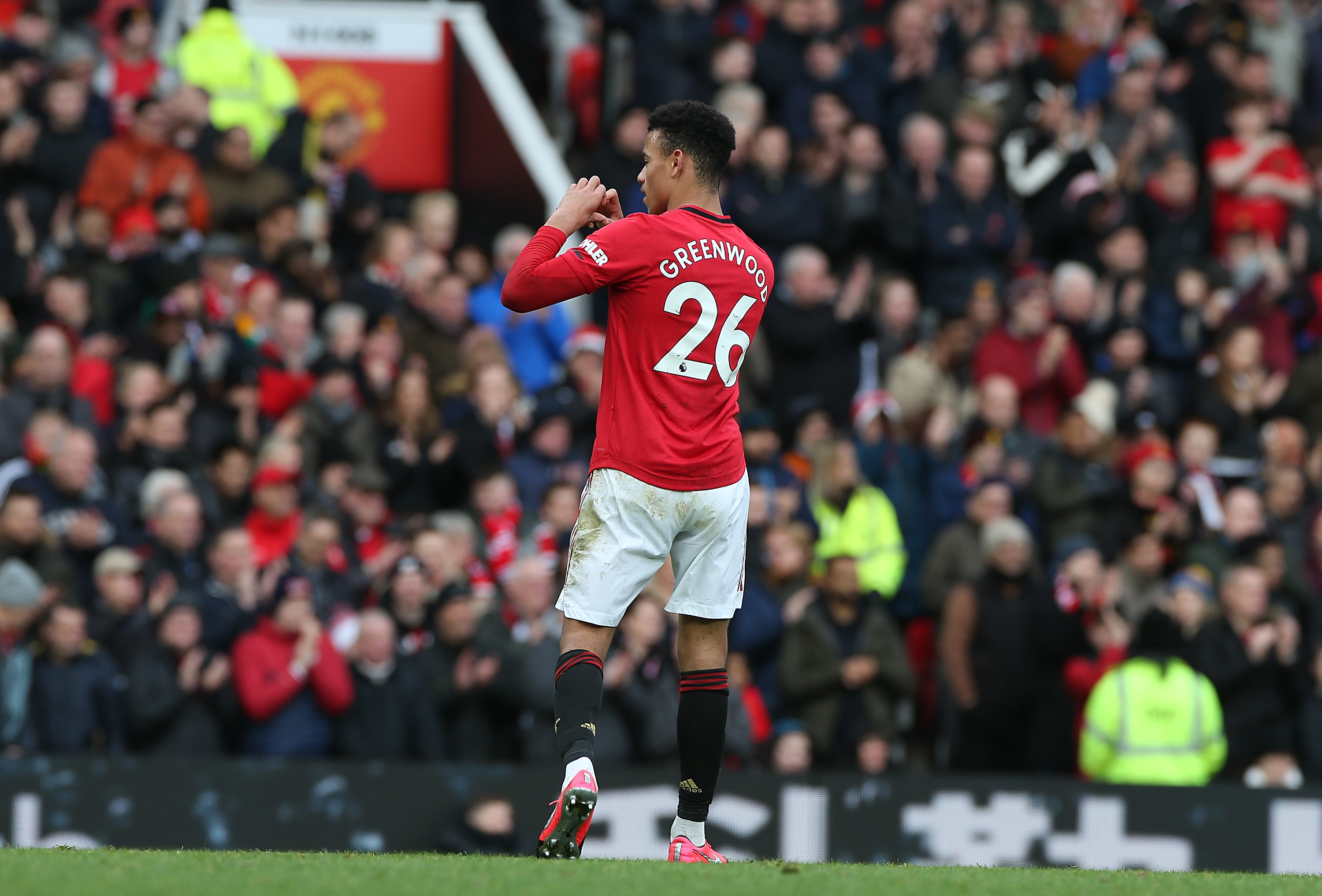 Mason Greenwood of Manchester United celebrates scoring their third goal during the Premier League match between Manchester United and Watford FC at Old Trafford