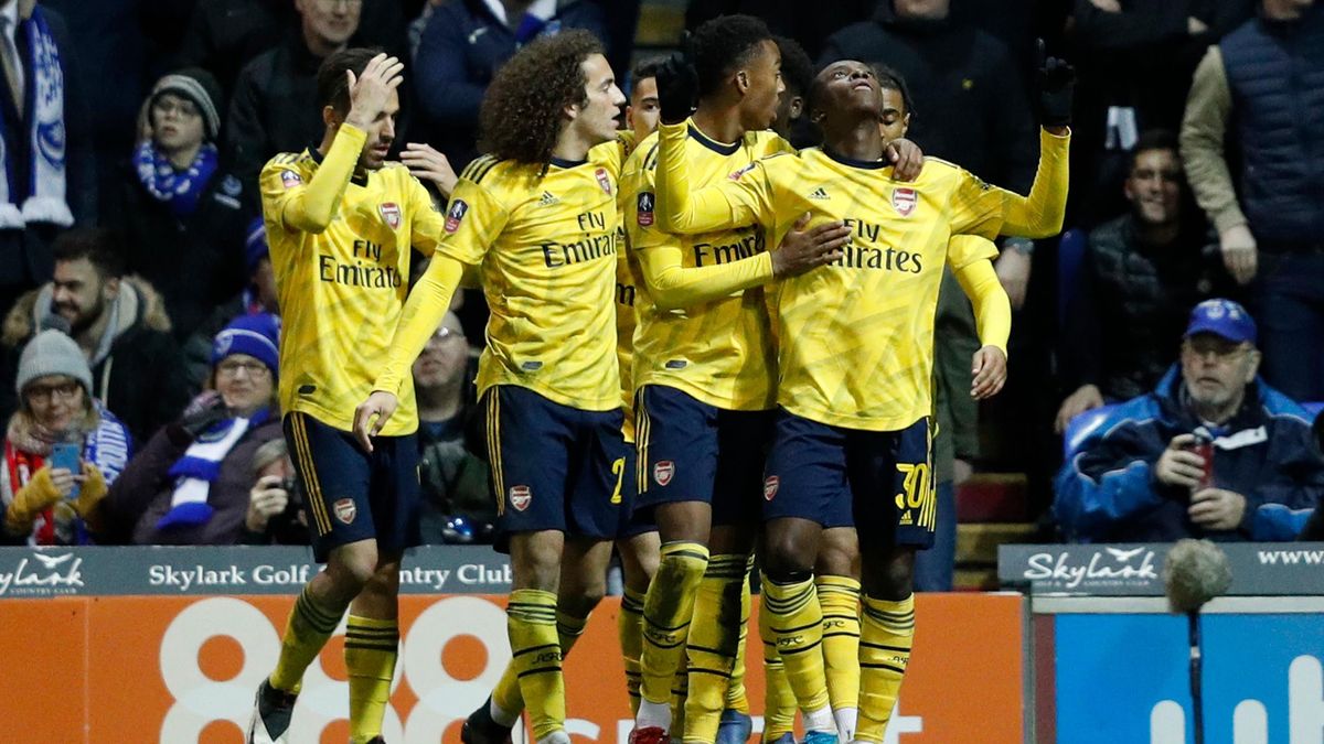Arsenal's English striker Eddie Nketiah (R) celebrates scoring their second goal during the English FA Cup fifth round football match between Portsmouth and Arsenal at Fratton Park