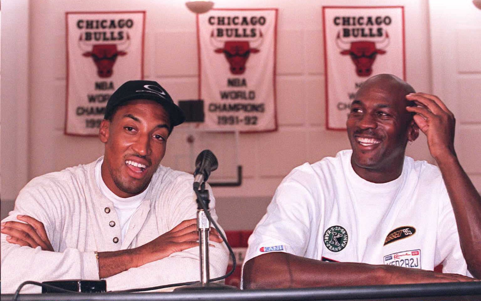 Michael Jordan (R) and Scottie Pippen (L) laugh at a question about their newly aquired teammate, Dennis Rodman, before their first team meeting 05 October in Deerfield, Ill.