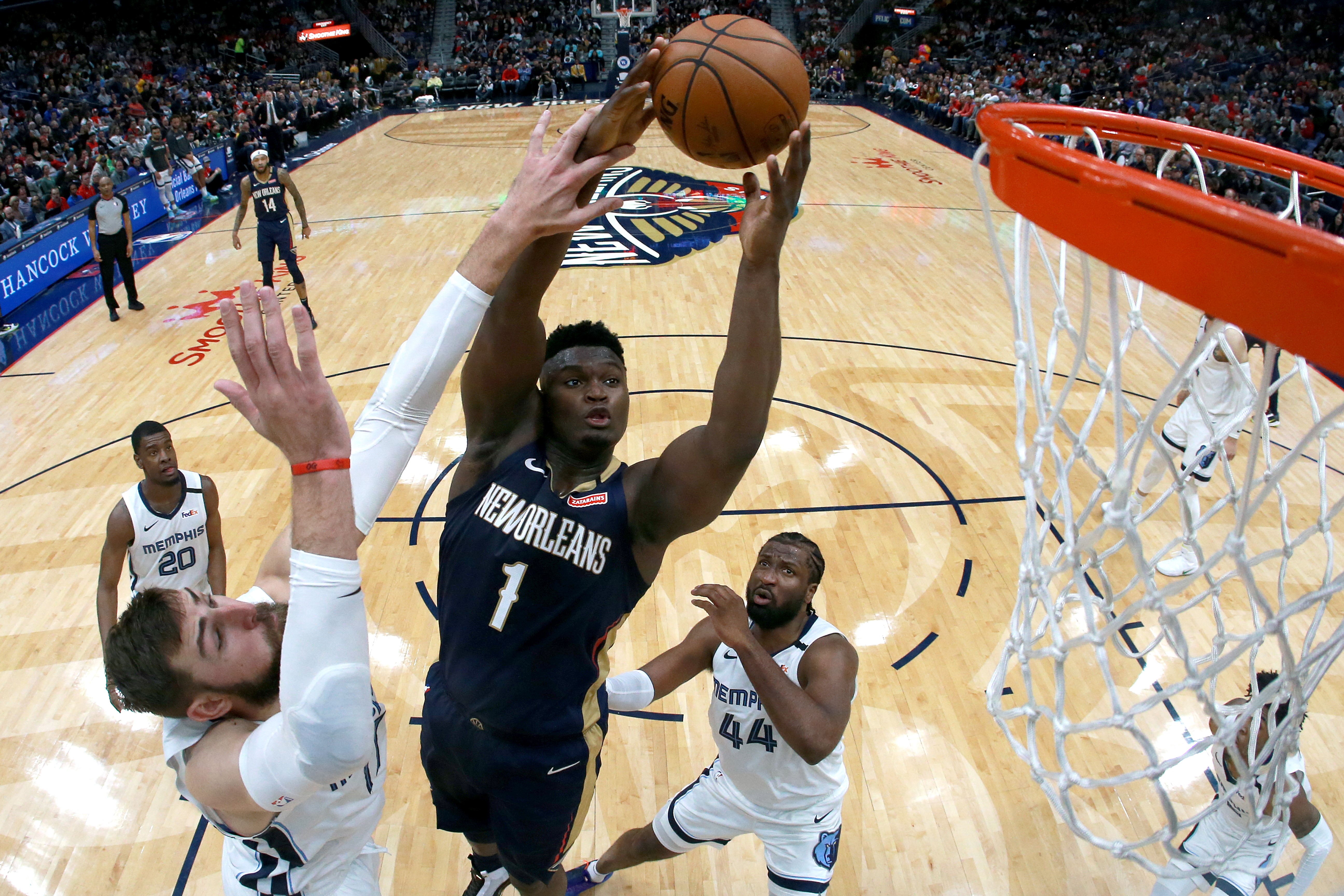 Zion Williamson #1 of the New Orleans Pelicans shoots over Jonas Valanciunas #17 of the Memphis Grizzlies during a NBA game at Smoothie King Center on