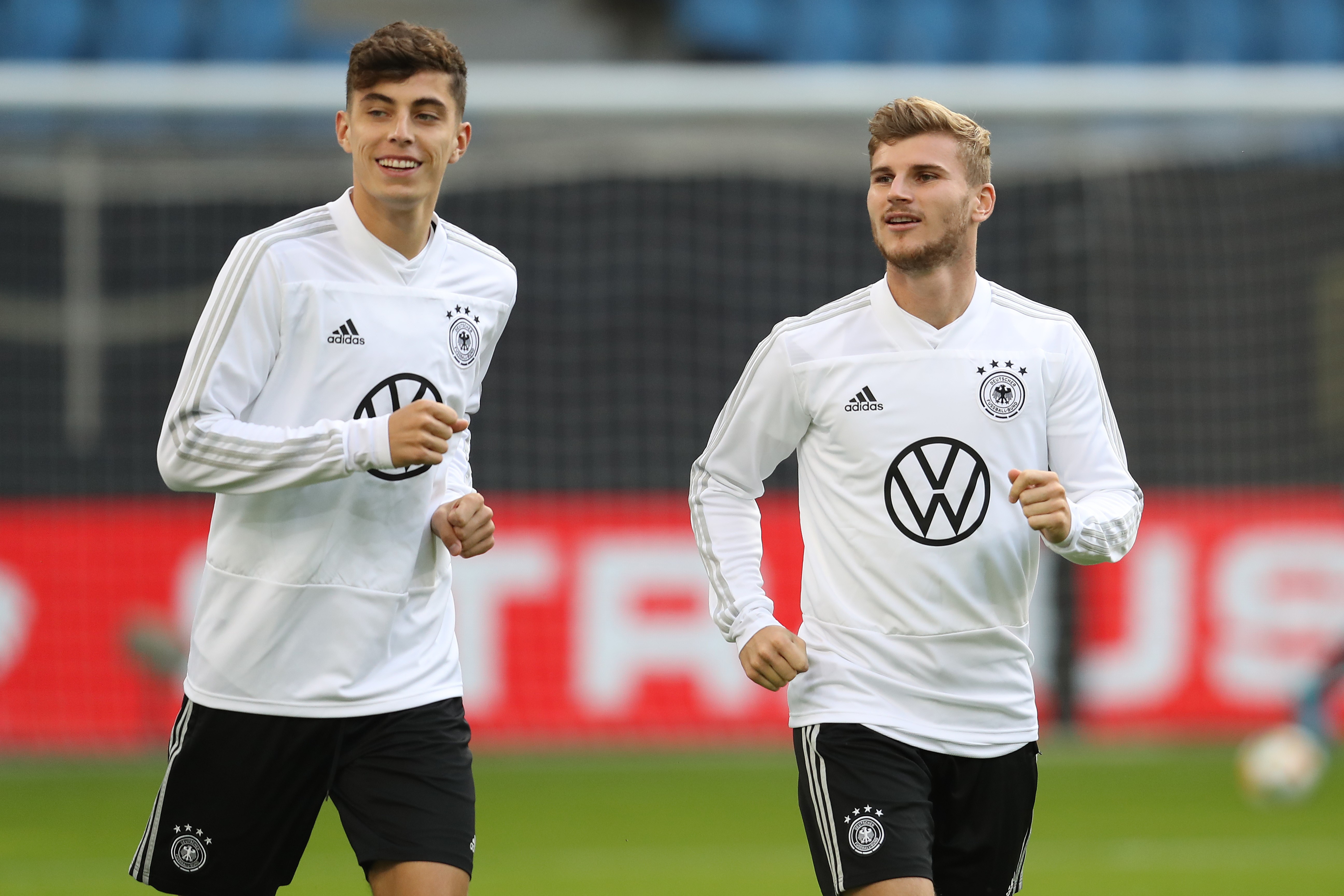 Kai Havertz of Germany smiles with team mate Timo Werner (R) during a training session of the German national team prior to the UEFA Euro 2020 Qualifier match against Netherland at Volksparkstadion on September 05, 2019 in Hamburg, Germany.