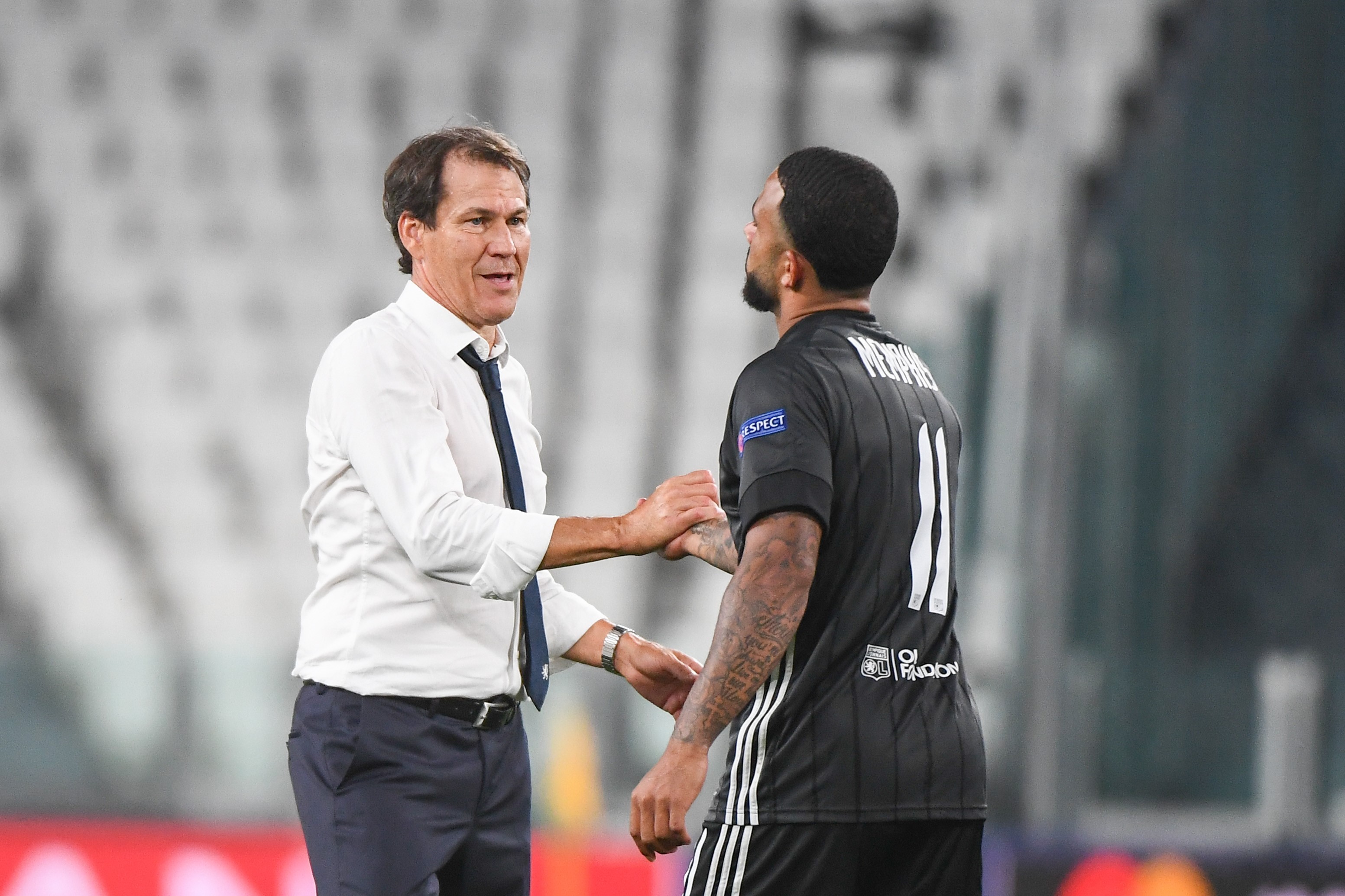 Rudi GARCIA coach of Lyon celebrates the victory with Memphis DEPAY of Lyon during the UEFA Champions League - round of 16 second leg match between Juventus and Lyon on August 7, 2020 in Turin, Italy