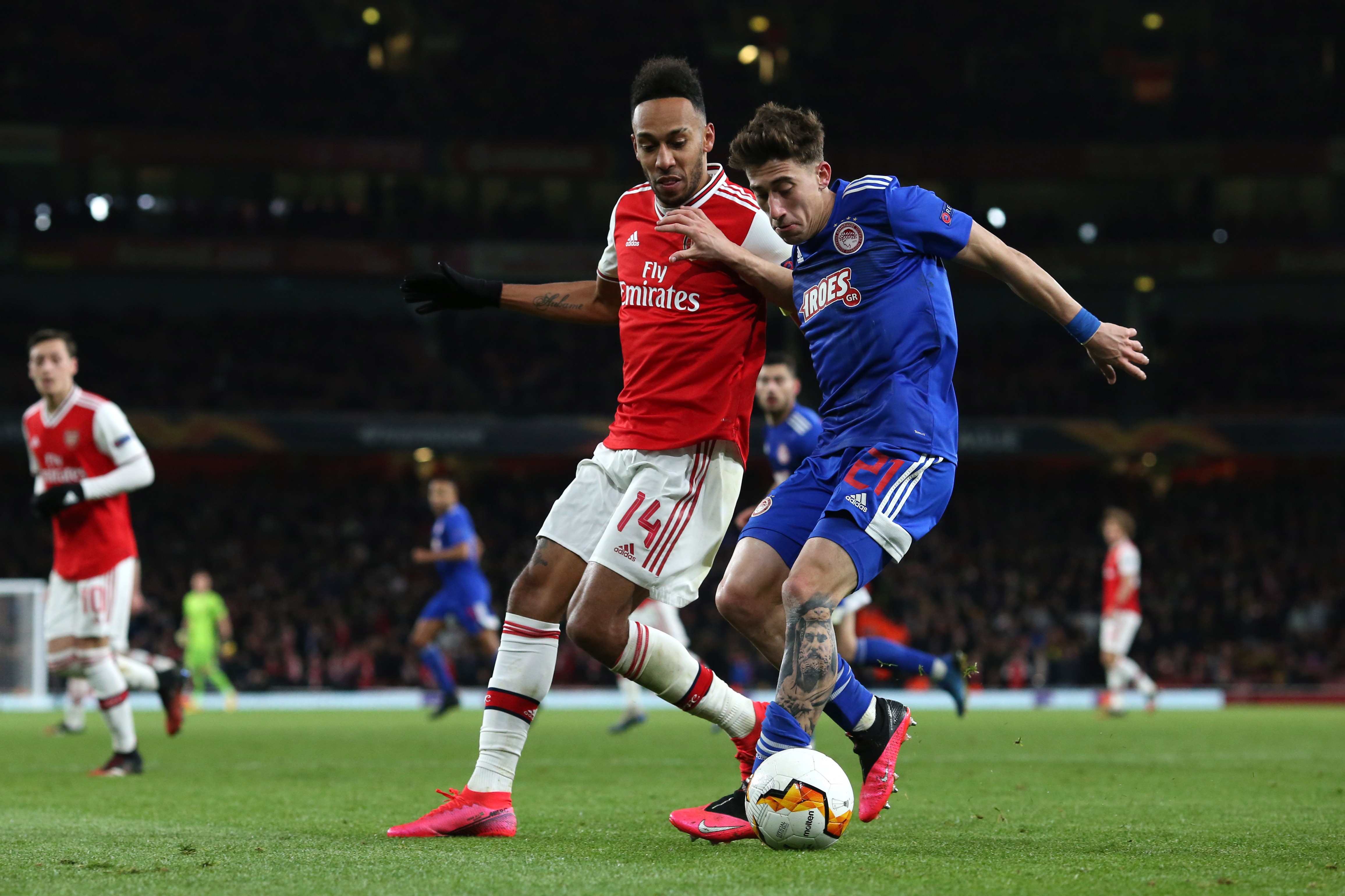 Pierre-Emerick Aubameyang of Arsenal and Kostas Tsimikas of Olympiacos during the UEFA Europa League round of 32 second leg match between Arsenal FC and Olympiacos FC at Emirates Stadium on February 27, 2020 in London, United Kingdom