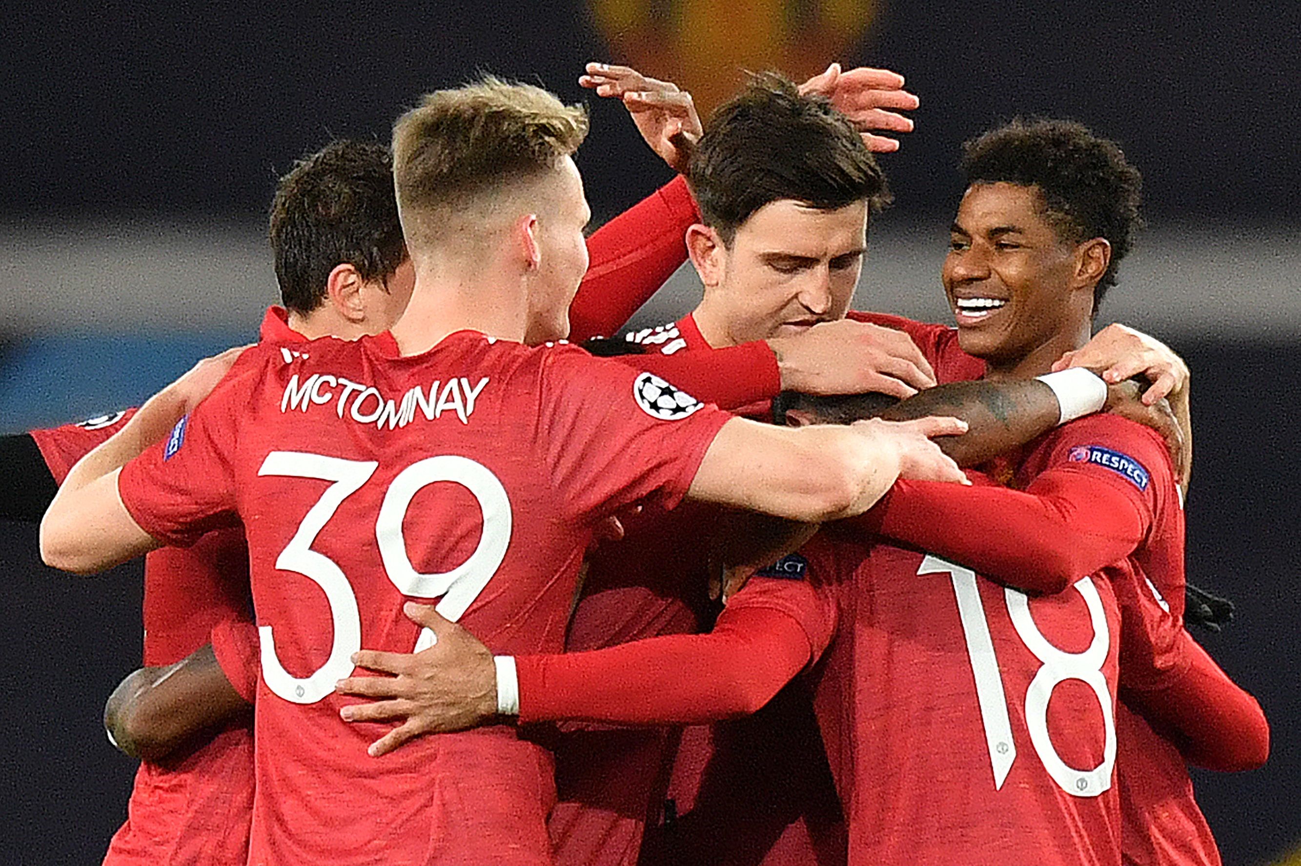 Marcus Rashford (R) celebrates scoring his team's second goal during the UEFA Champions league group H football match between Manchester United and RB Leipzig at Old Trafford stadium in Manchester