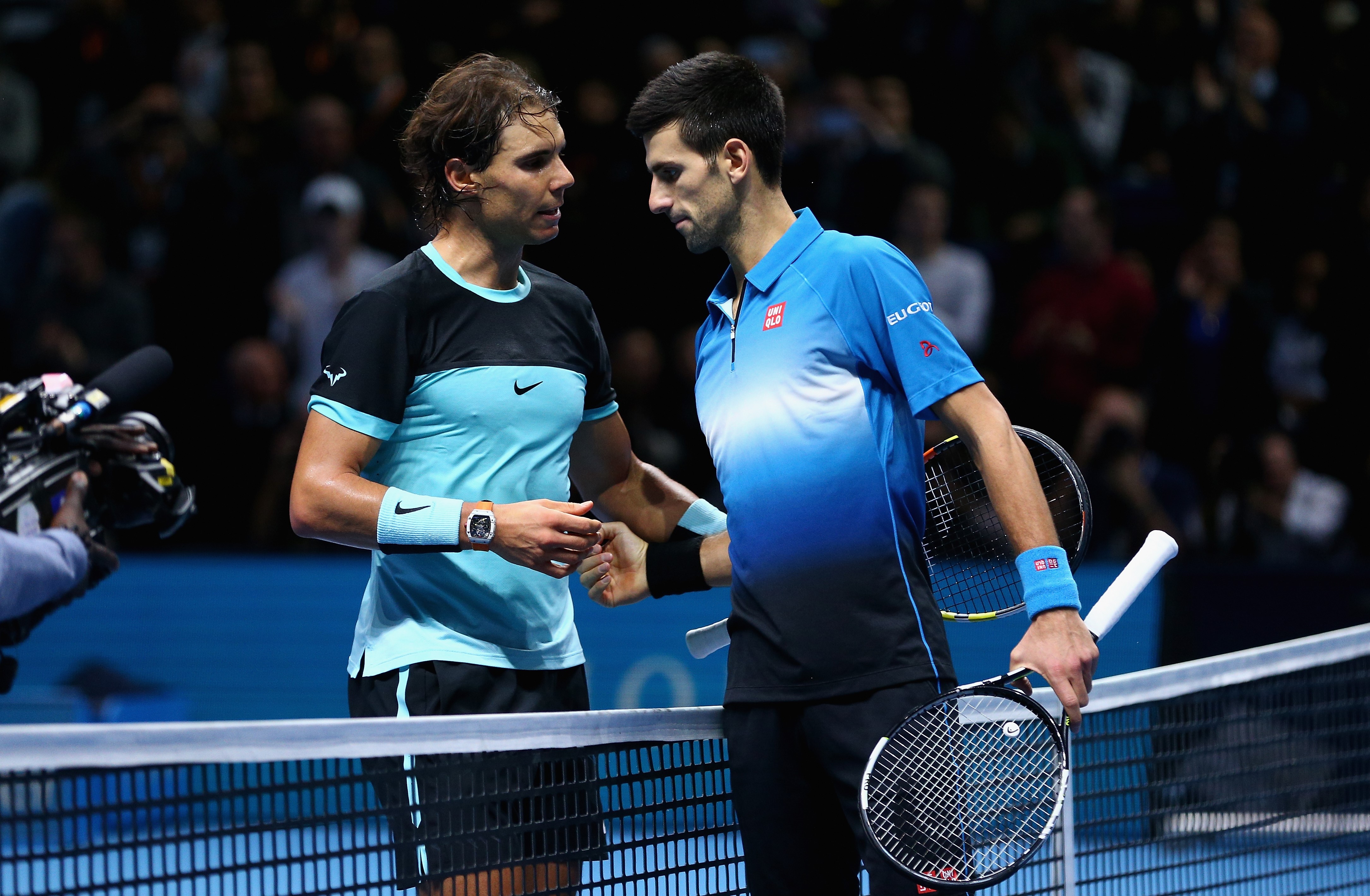 Novak Djokovic of Serbia shakes hands at the net after his straight sets victory against Rafael Nadal of Spain during the men's singles semi final match on day seven of the Barclays ATP World Tour Finals at O2 Arena on November 21, 2015 in London