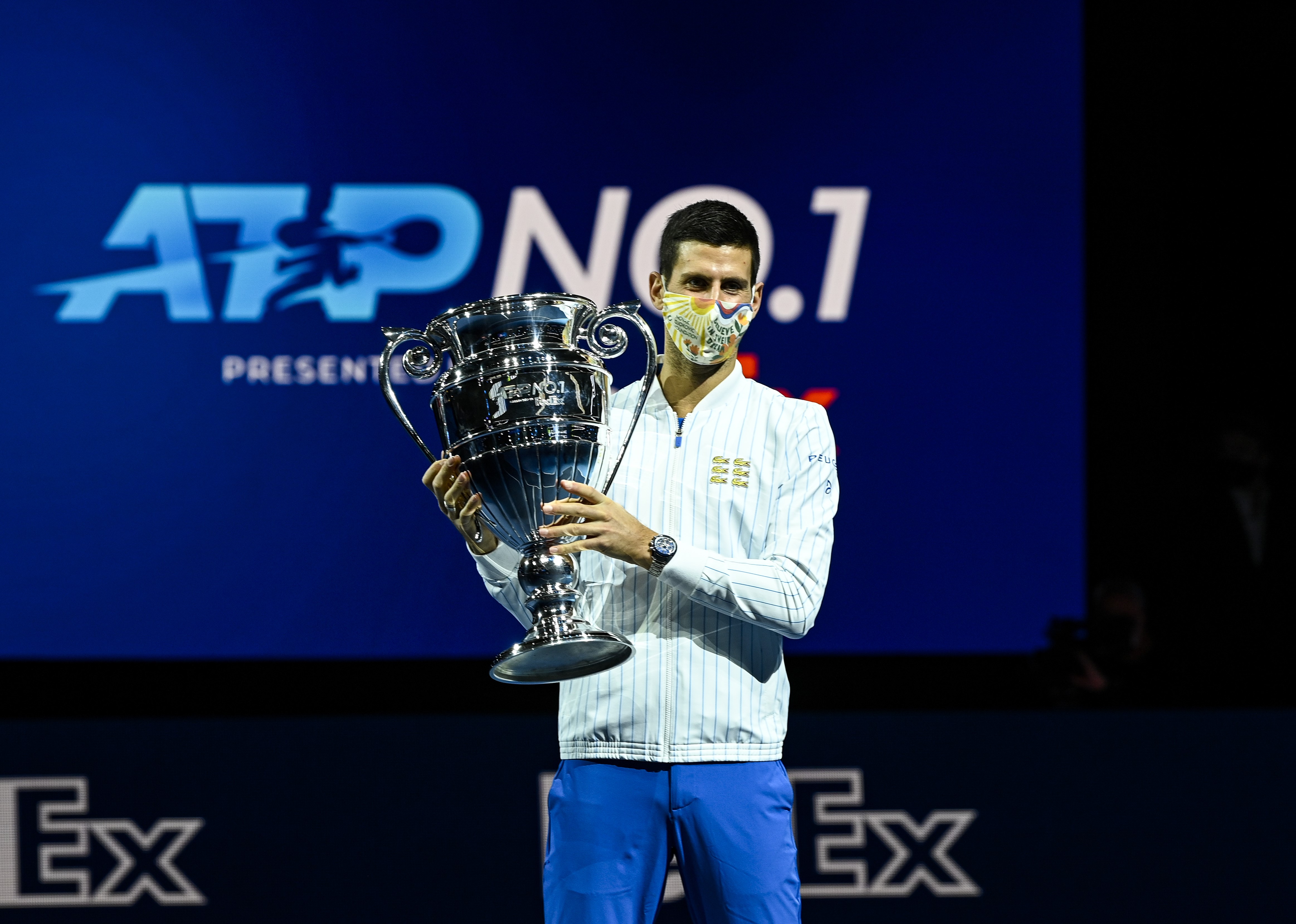 Novak Djokovic of Serbia is presented with the trophy for ending 2020 as the ATP number 1 player during Day 1 of the Nitto ATP World Tour Finals at The O2 Arena