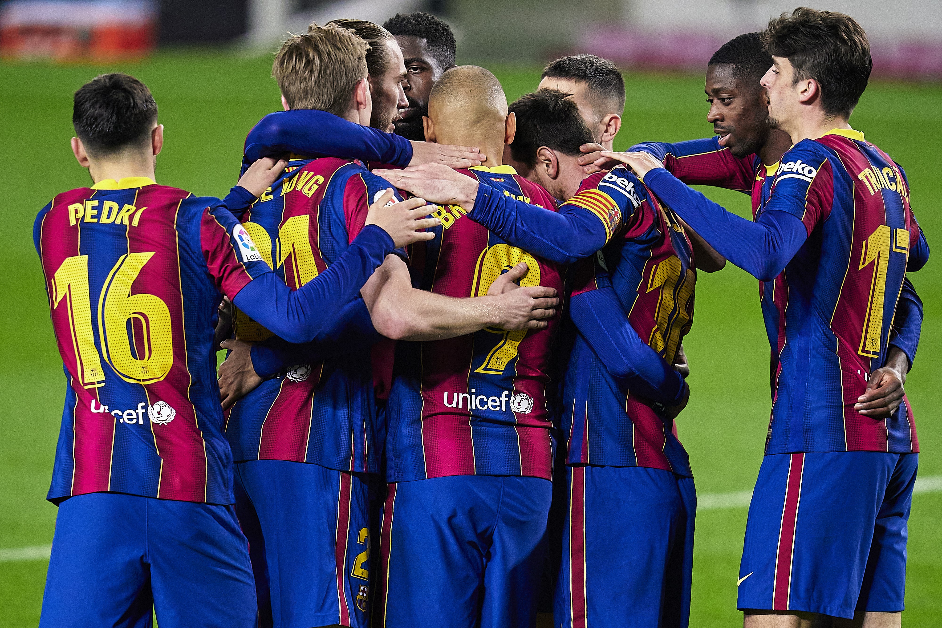 Players of FC Barcelona celebrating after scoring their team's opening goal during the La Liga Santander match between FC Barcelona and Elche CF at Camp Nou on February 24, 2021 in Barcelona, Spain.