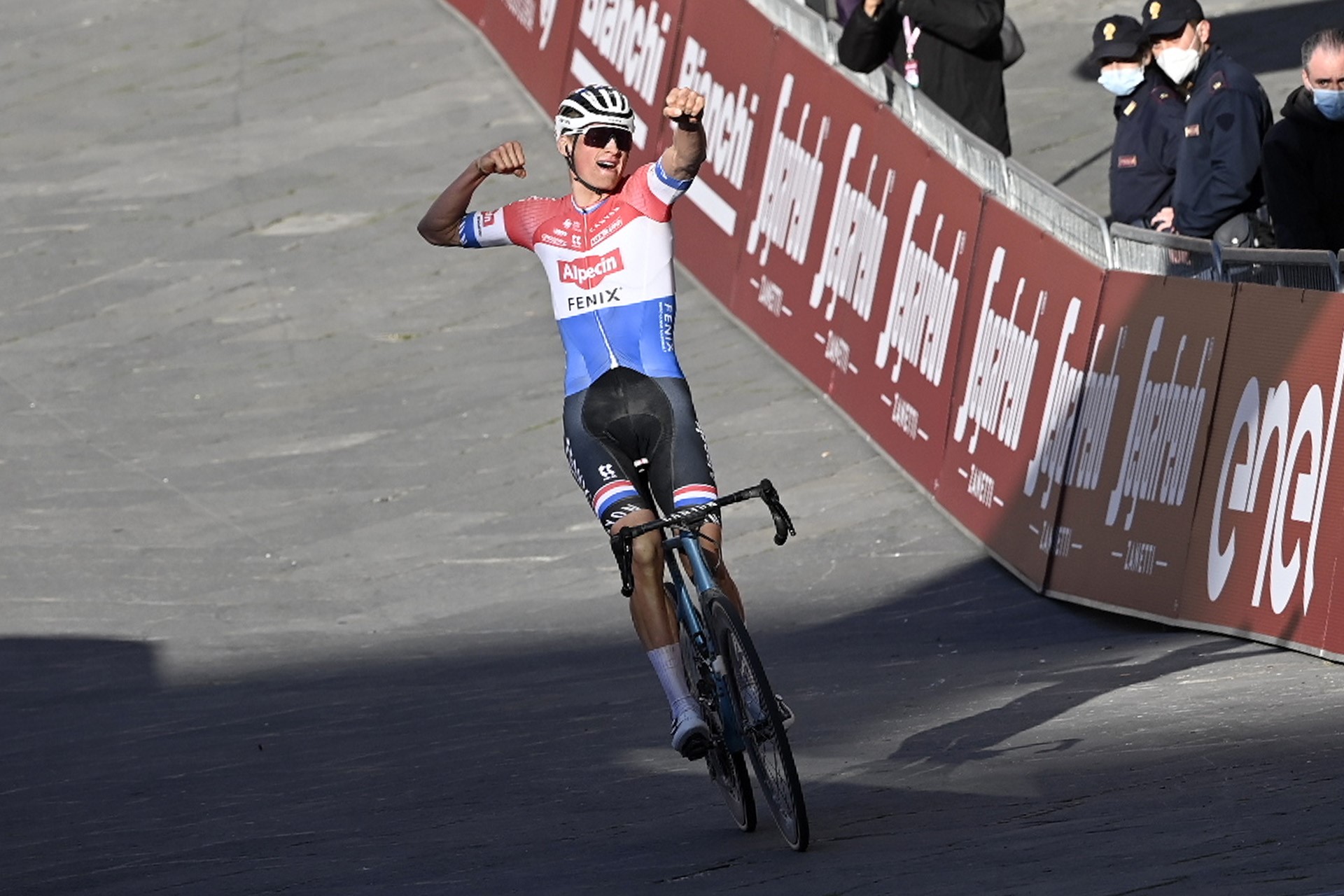 Dutch Mathieu van der Poel of Alpecin-Fenix celebrates as he crosses the finish line to win the 'Strade Bianche' one day cycling race (184km) from and to Siena, Italy