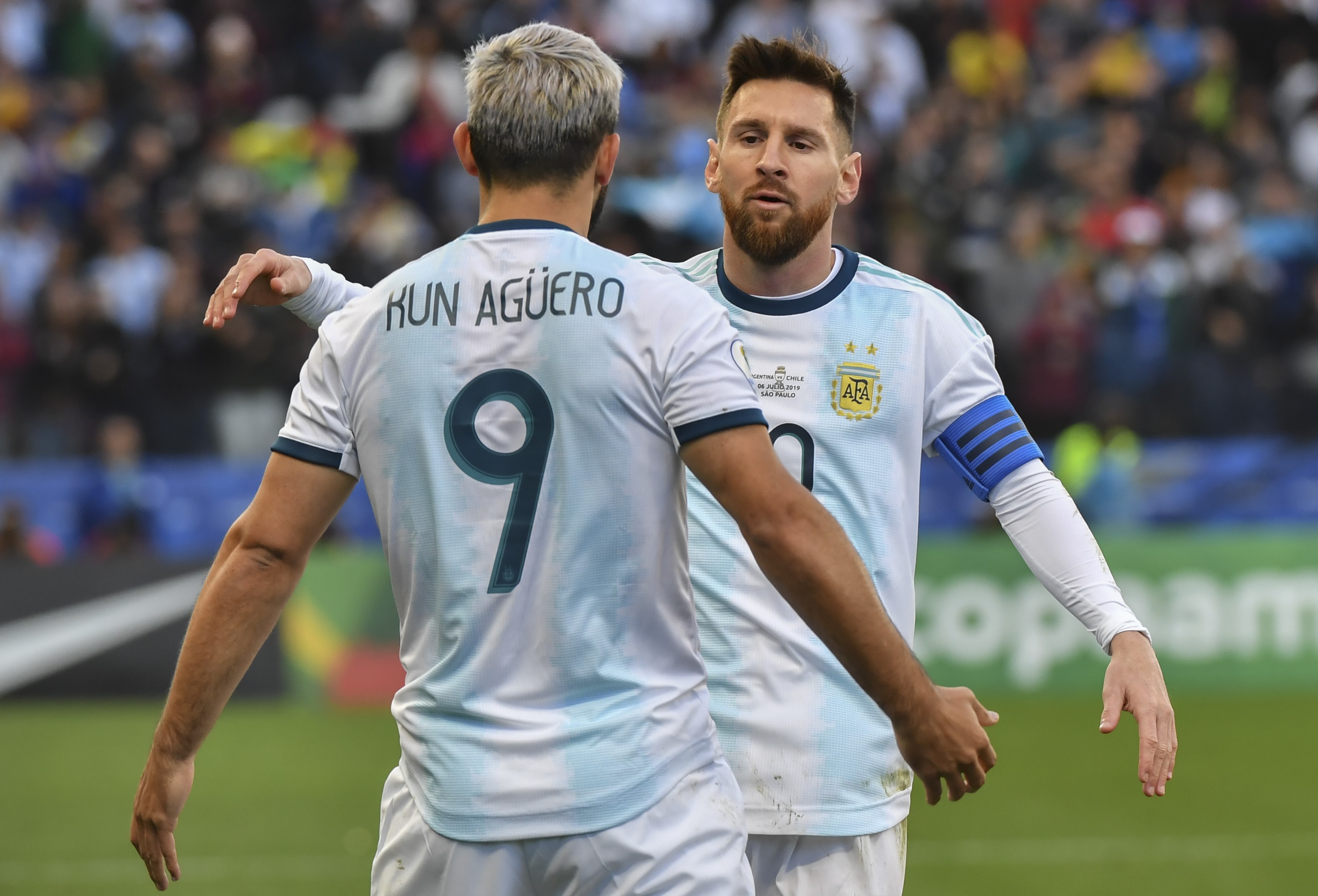 Argentina's Sergio Aguero (L) celebrates with teammate Lionel Messi after scoring against Chile during their Copa America football tournament third-place match at the Corinthians Arena in Sao Paulo, Brazil, on July 6, 2019