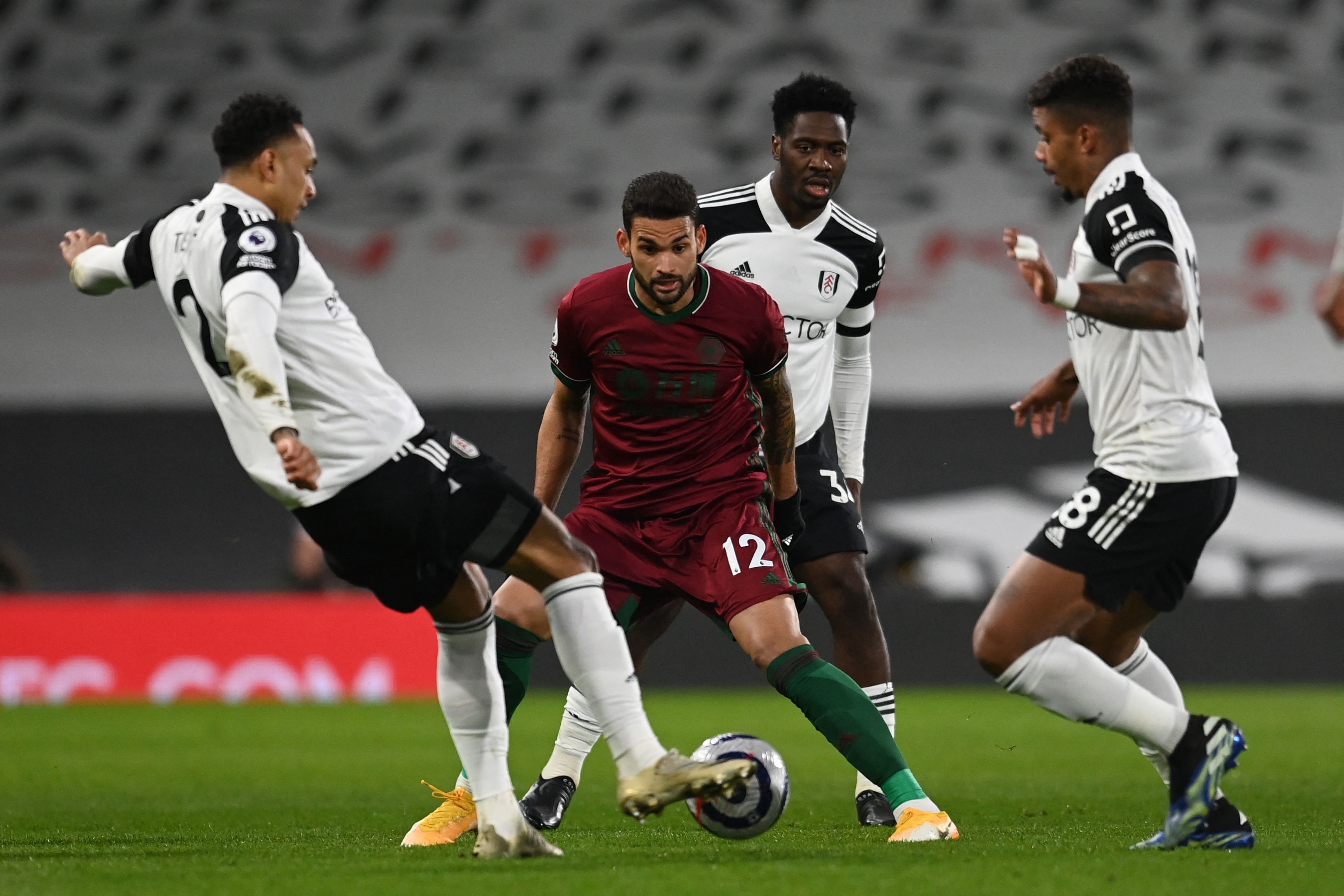 Wolverhampton Wanderers' Brazilian striker Willian José (C) in action during the English Premier League football match between Fulham and Wolverhampton Wanderers at Craven Cottage in London on April 9, 2021.