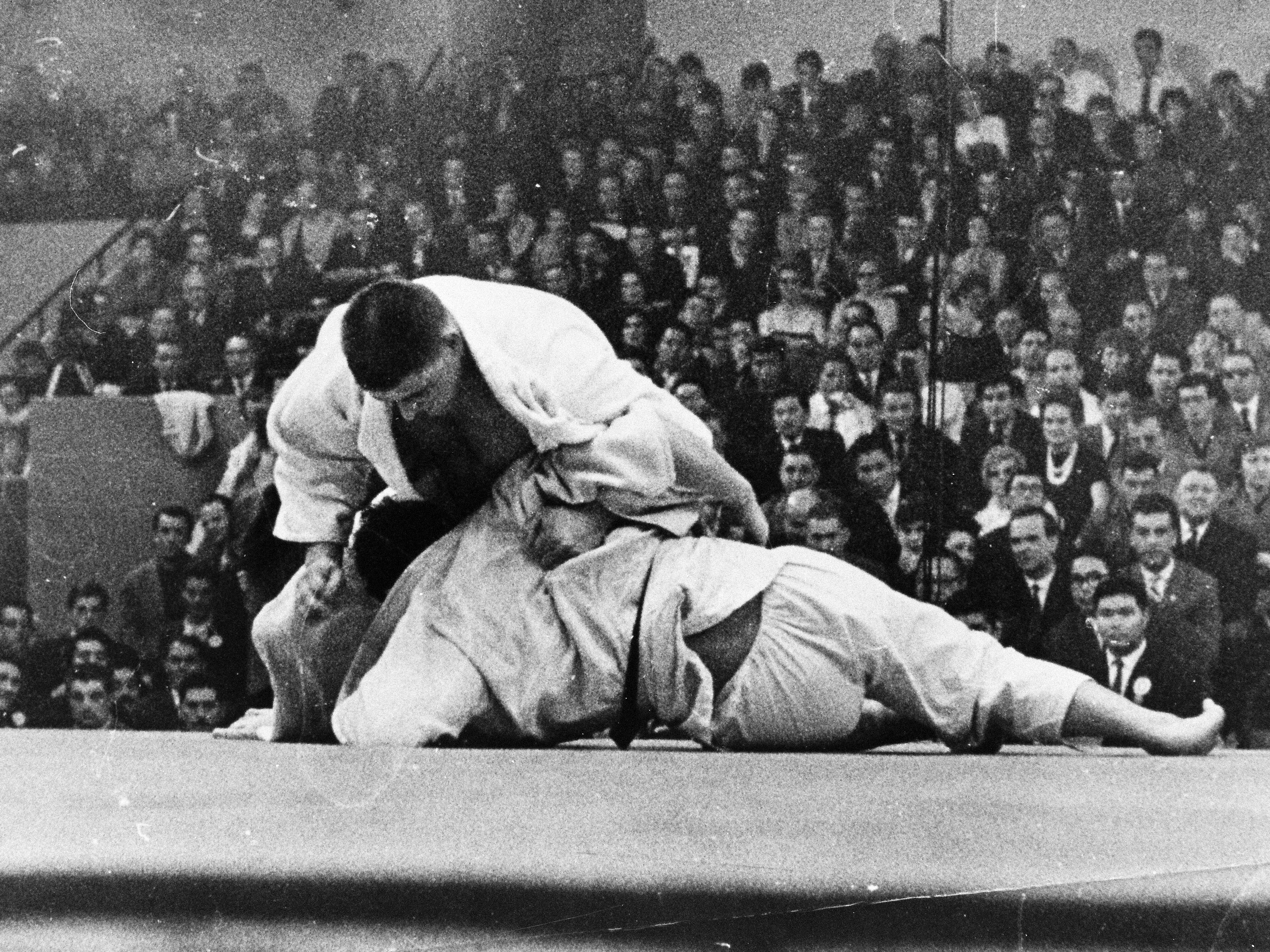 Anton Geesink (top) of the Netherland holds Koji Sone (bottom) of Japan in the final during the World Judo Championship on December 2, 1961 in Paris, France.