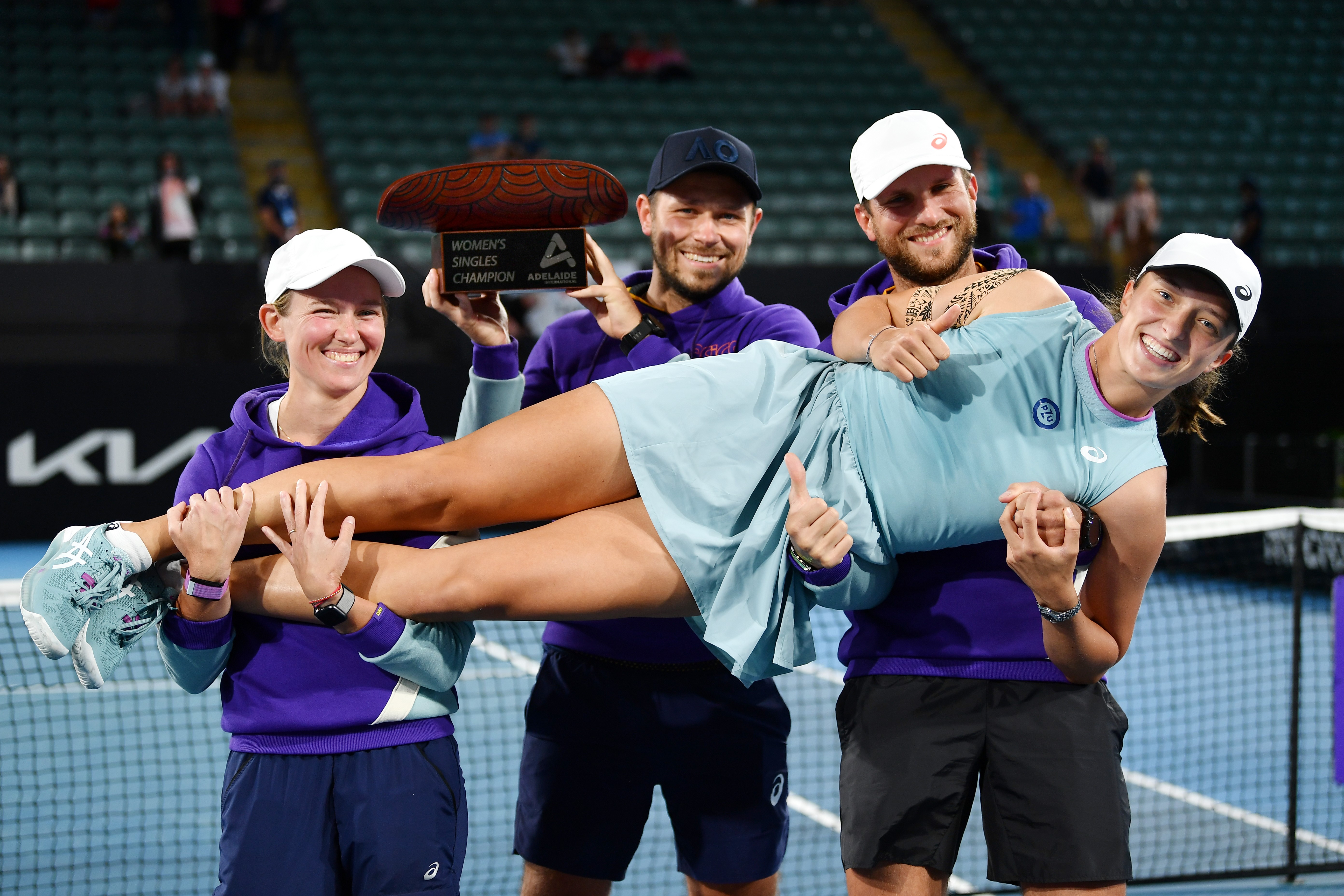 Iga Swiatek celebrates with her team after winning the Adelaide International in February