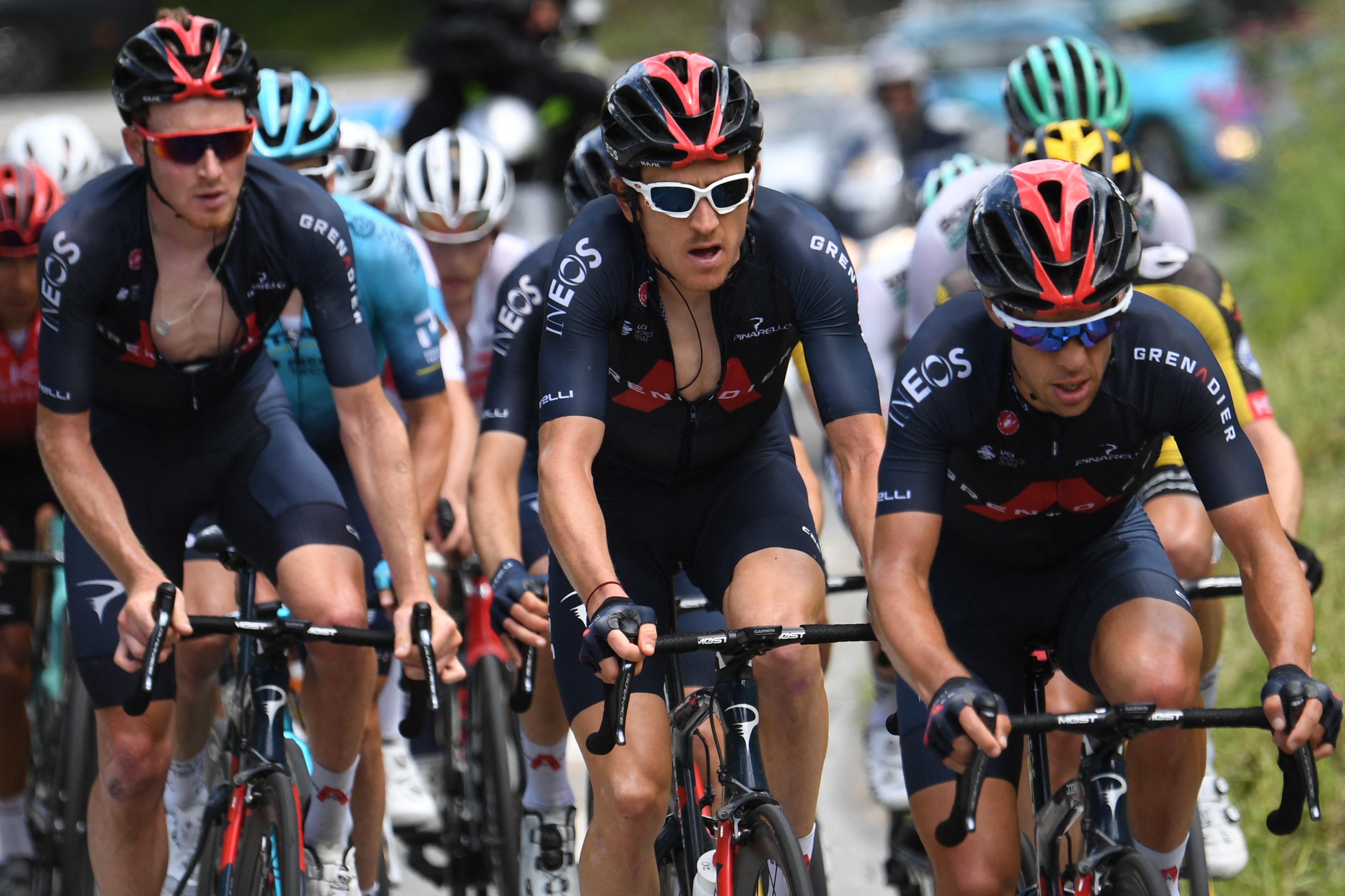 (From L) Team Ineos' Tao Geoghegan Hart of Great Britain, Team Ineos' Geraint Thomas of Great Britain and Team Ineos' Richie Porte of Australia ride during the seventh stage of the 73rd edition of the Criterium du Dauphine cycling race-