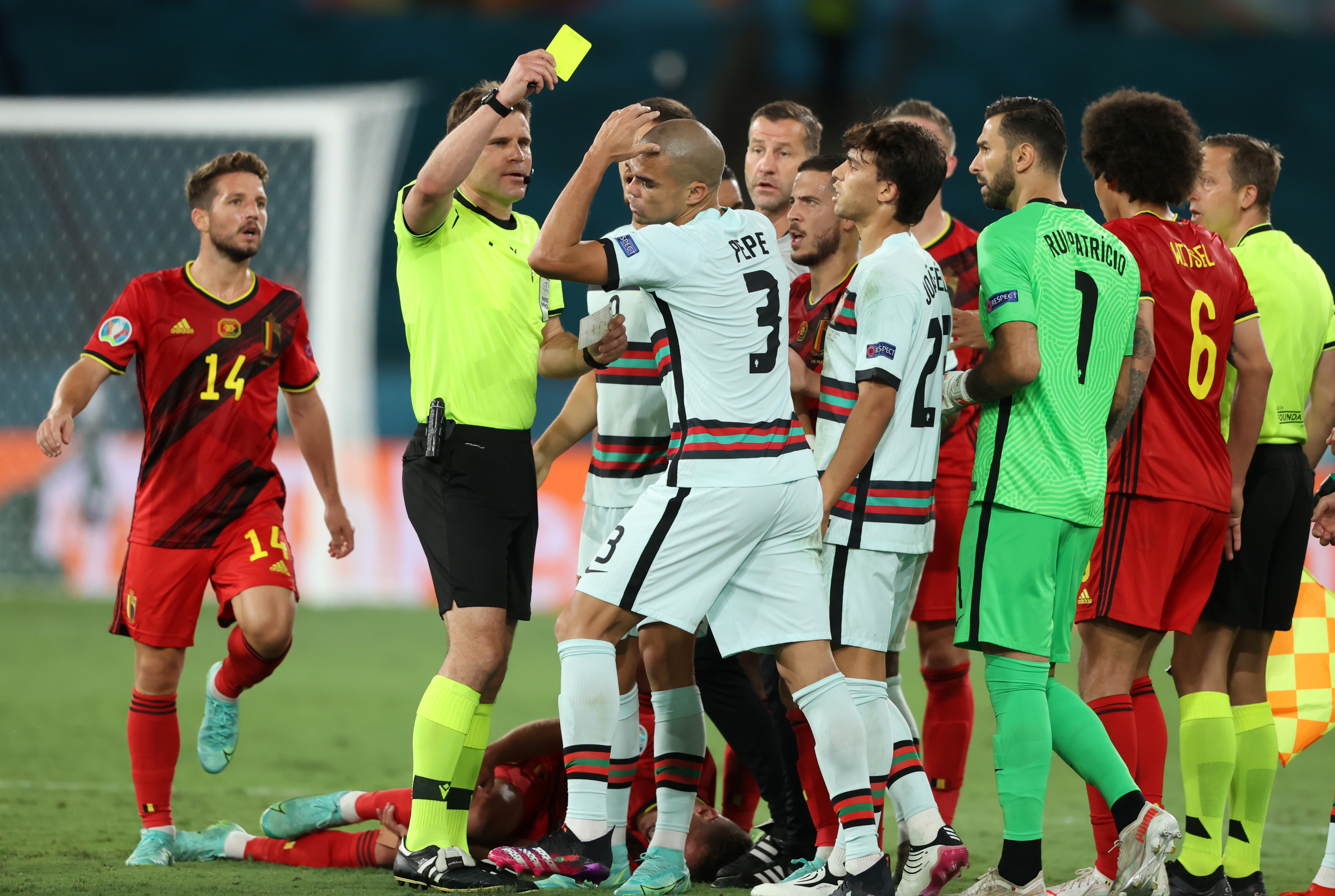 SEVILLE, SPAIN - JUNE 27: Pepe of Portugal is shown a yellow card by Match Referee, Felix Brych during the UEFA Euro 2020 Championship Round of 16 match between Belgium and Portugal at Estadio La Cartuja on June 27, 2021 in Seville, Spain.