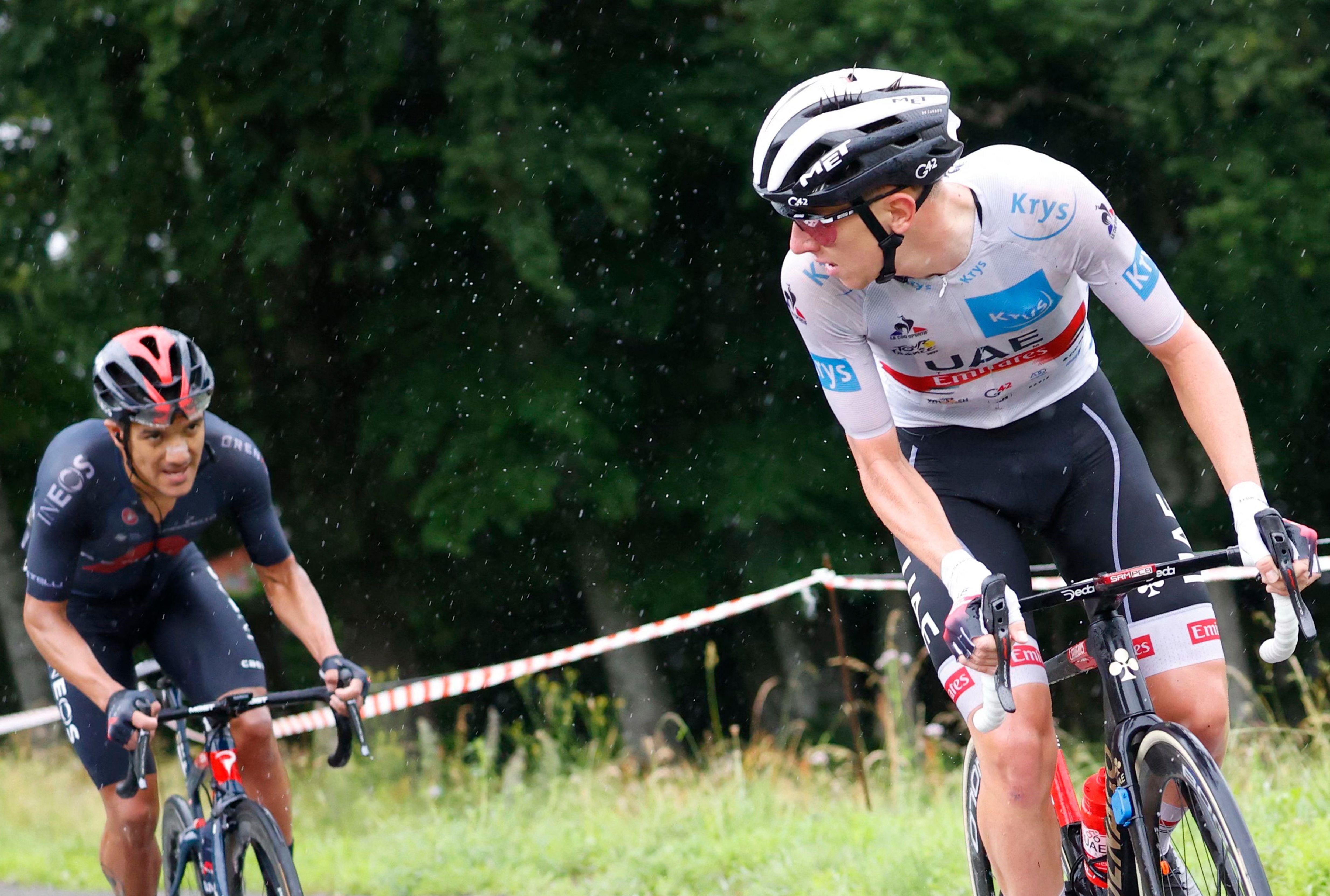 Team UAE Emirates' Tadej Pogacar of Slovenia wearing the best young's white jersey (R) looks at Team Ineos Grenadiers' Richard Carapaz of Ecuador during the 8th stage of the 108th edition of the Tour de France cycling race, 150 km between Oyonnax and Le G