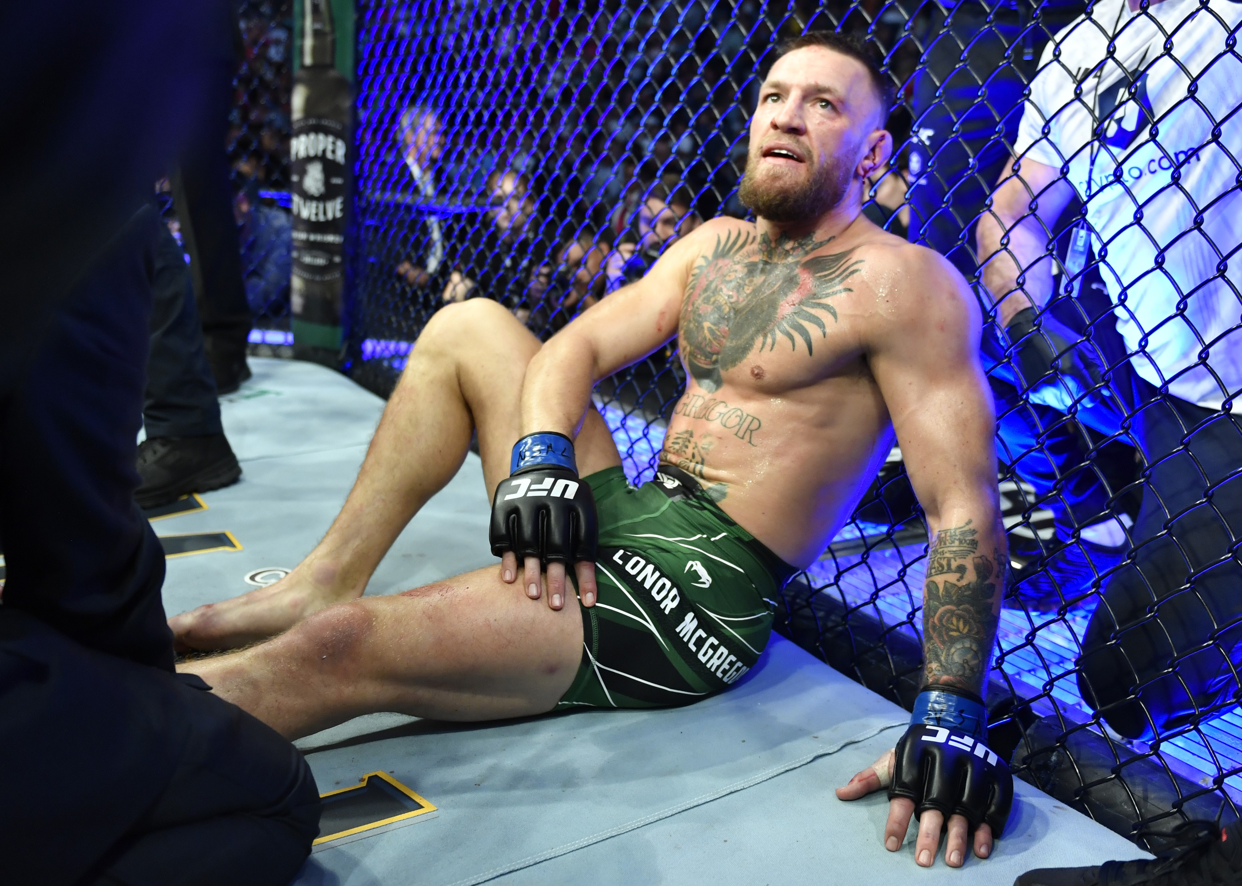 Conor McGregor of Ireland reacts after his TKO loss due to injury against Dustin Poirier during the UFC 264 event at T-Mobile Arena on July 10, 2021 in Las Vegas, Nevada