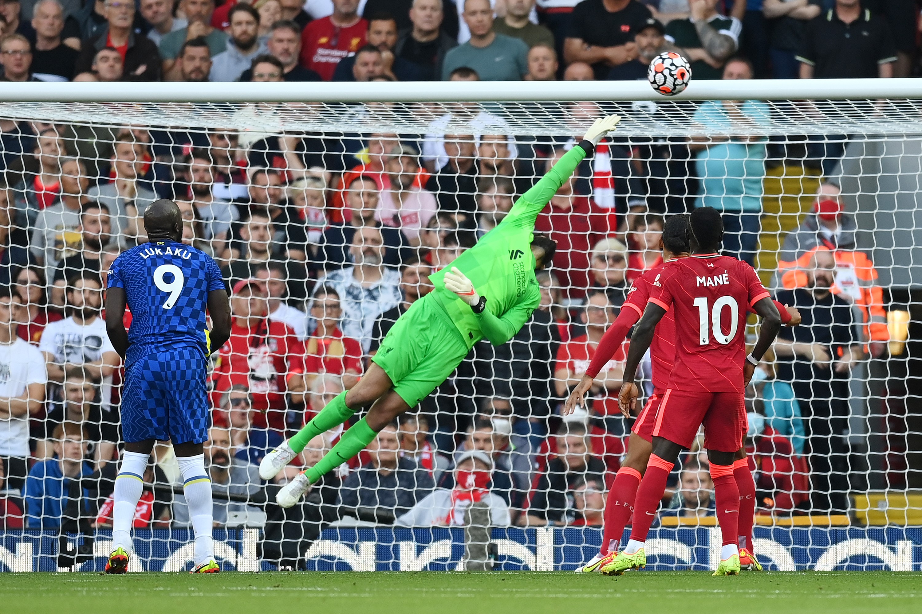 Liverpool goalkeeper Alisson Becker dives for the ball, Liverpool v Chelsea, Premier League, Anfield, Liverpool, August 28, 2021