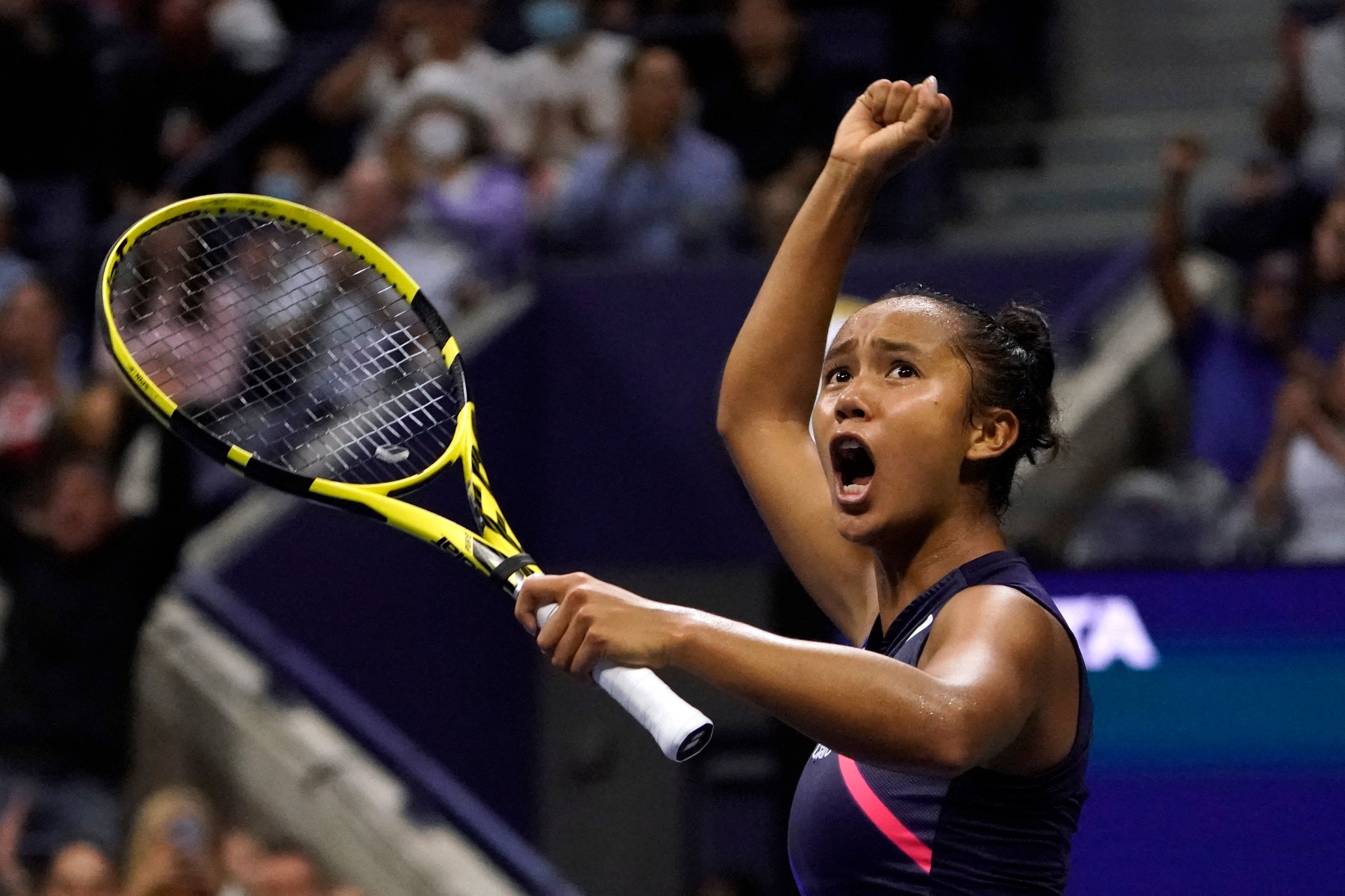 Canada's Leylah Fernandez celebrates after winning the first set against Belarus's Aryna Sabalenka during their 2021 US Open Tennis tournament women's semifinal match at the USTA Billie Jean King National Tennis Center in New York