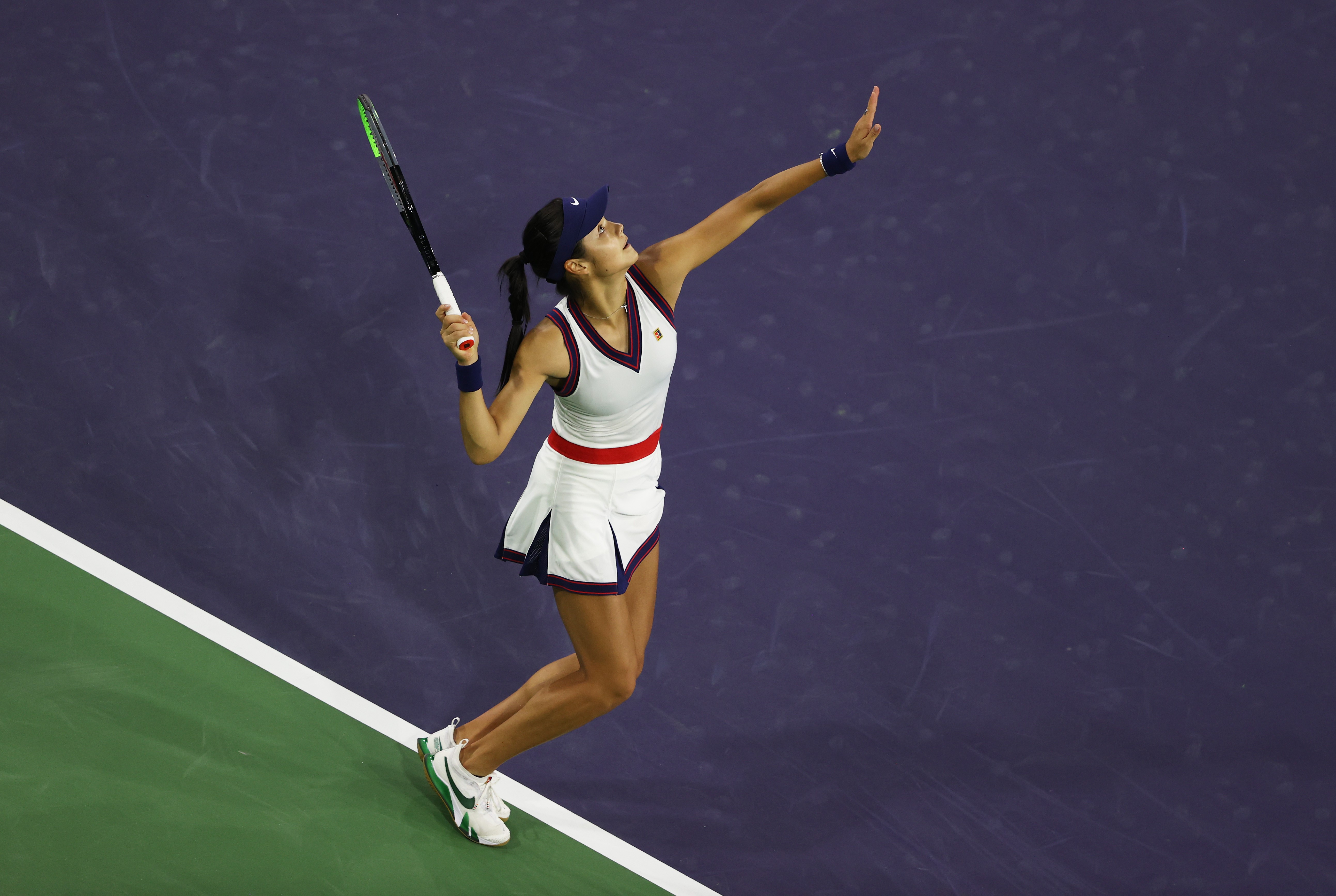 INDIAN WELLS, CALIFORNIA - OCTOBER 08: Emma Raducanu of Great Britain serves against Aliaksandra Sasnovich of Belarus in their second round match on Day 5 of the BNP Paribas Open at the Indian Wells Tennis Garden on March 08, 2021 in Indian Wells