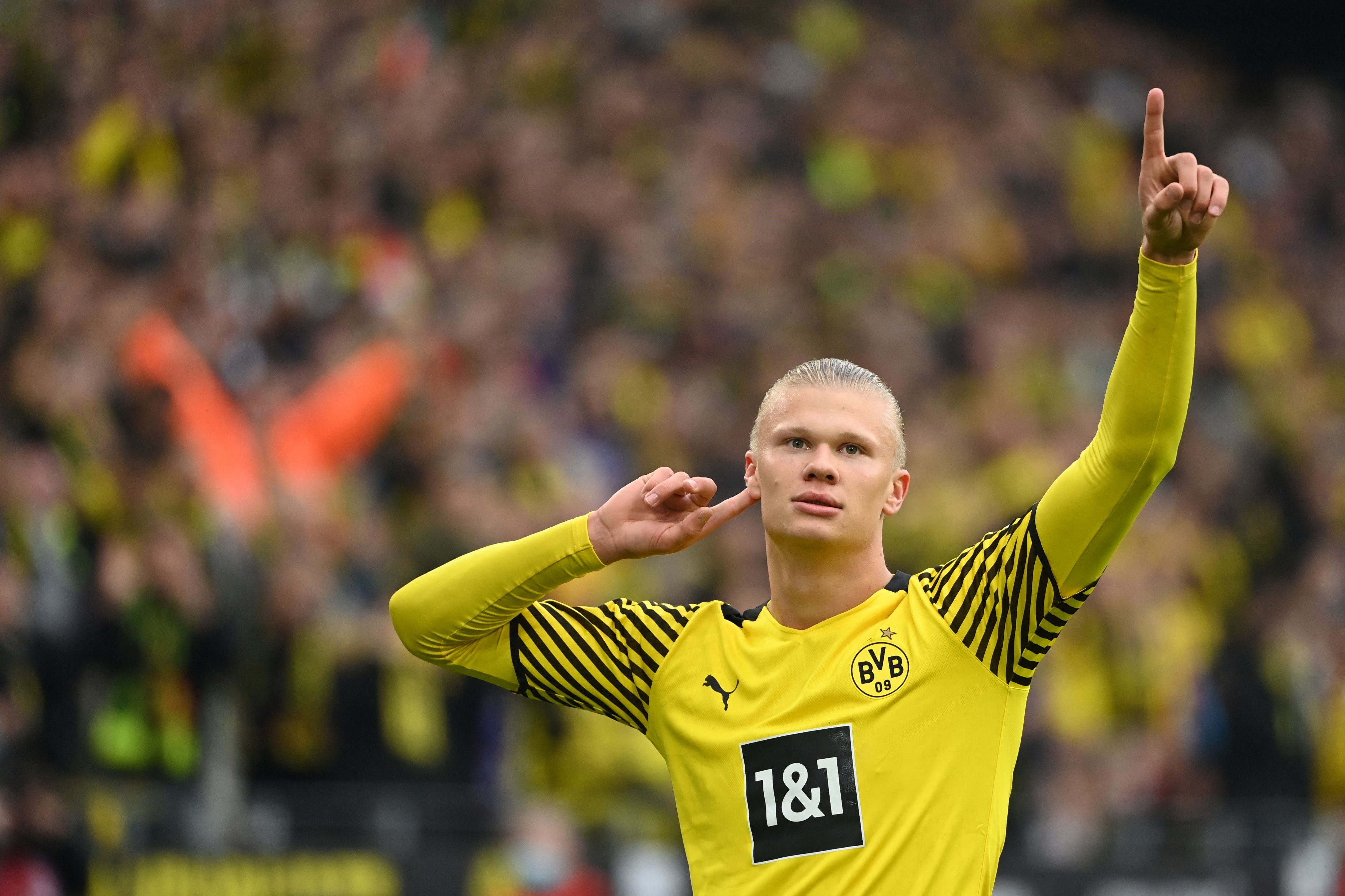 Dortmund's Norwegian forward Erling Braut Haaland celebrates scoring his team's second goal during the German first division Bundesliga football match BVB Borussia Dortmund v Mainz 05 in Dortmund, western Germany, on October 16, 2021