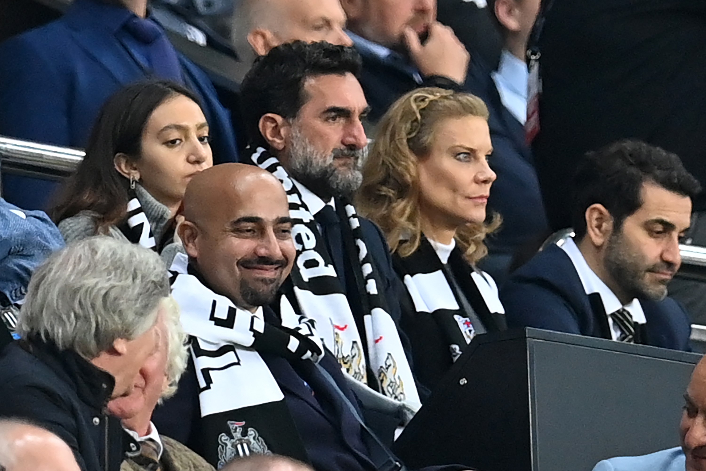 Newcastle United's Saudi Arabian chairman Yasir Al-Rumayyan (C) and Newcastle United's English minority owner Amanda Staveley (centre right)