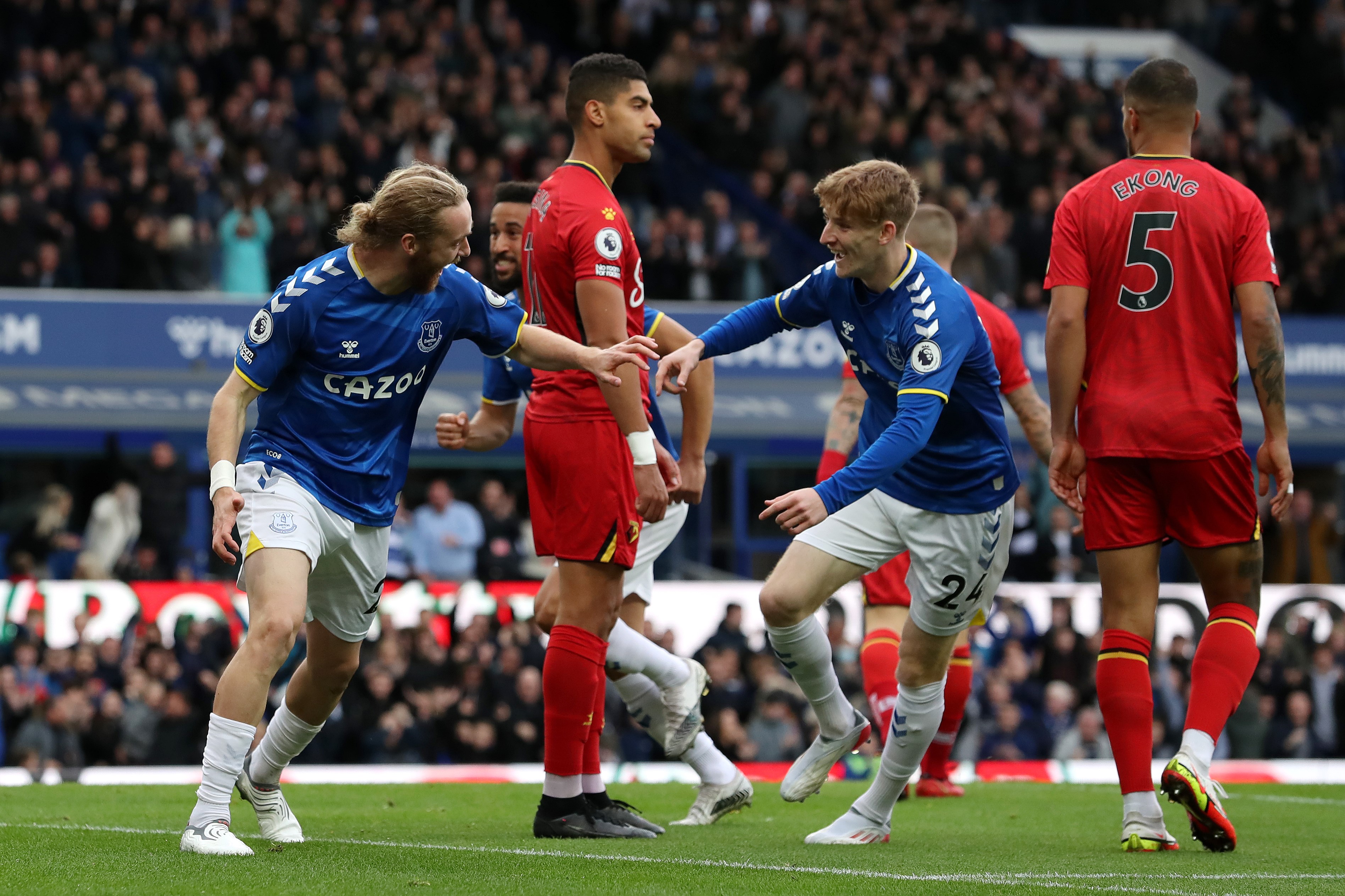 Tom Davies (L) of Everton celebrates with teammate Anthony Gordon after scoring their side's first goal during the Premier League match between Everton and Watford at Goodison Park on October 23, 2021 in Liverpool, England.