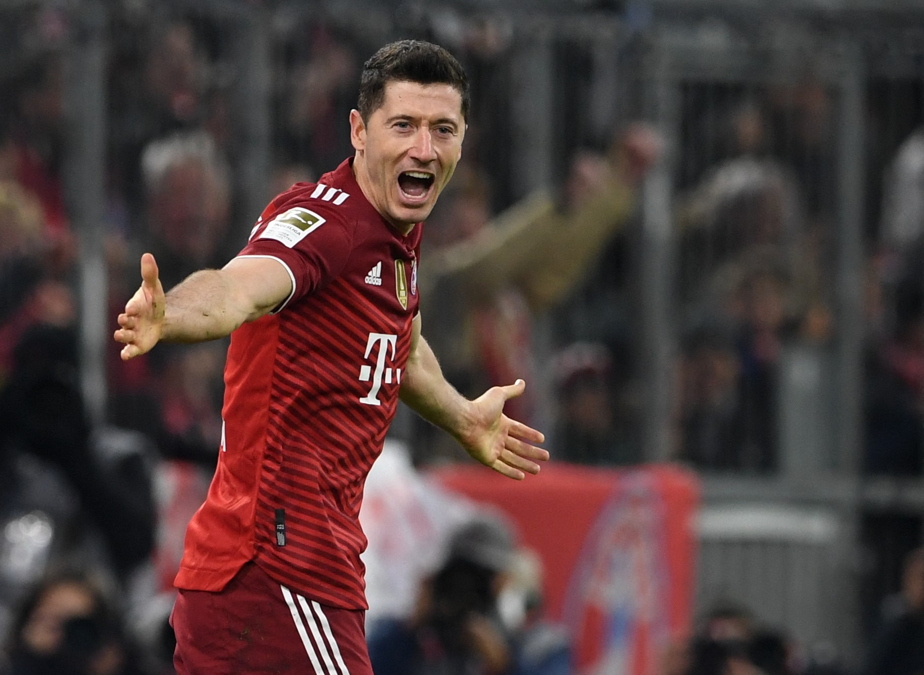 Bayern Munich's Polish forward Robert Lewandowski celebrates scoring the 2-0 goal during the German first division Bundesliga football match between FC Bayern Munich and SC Freiburg in Munich