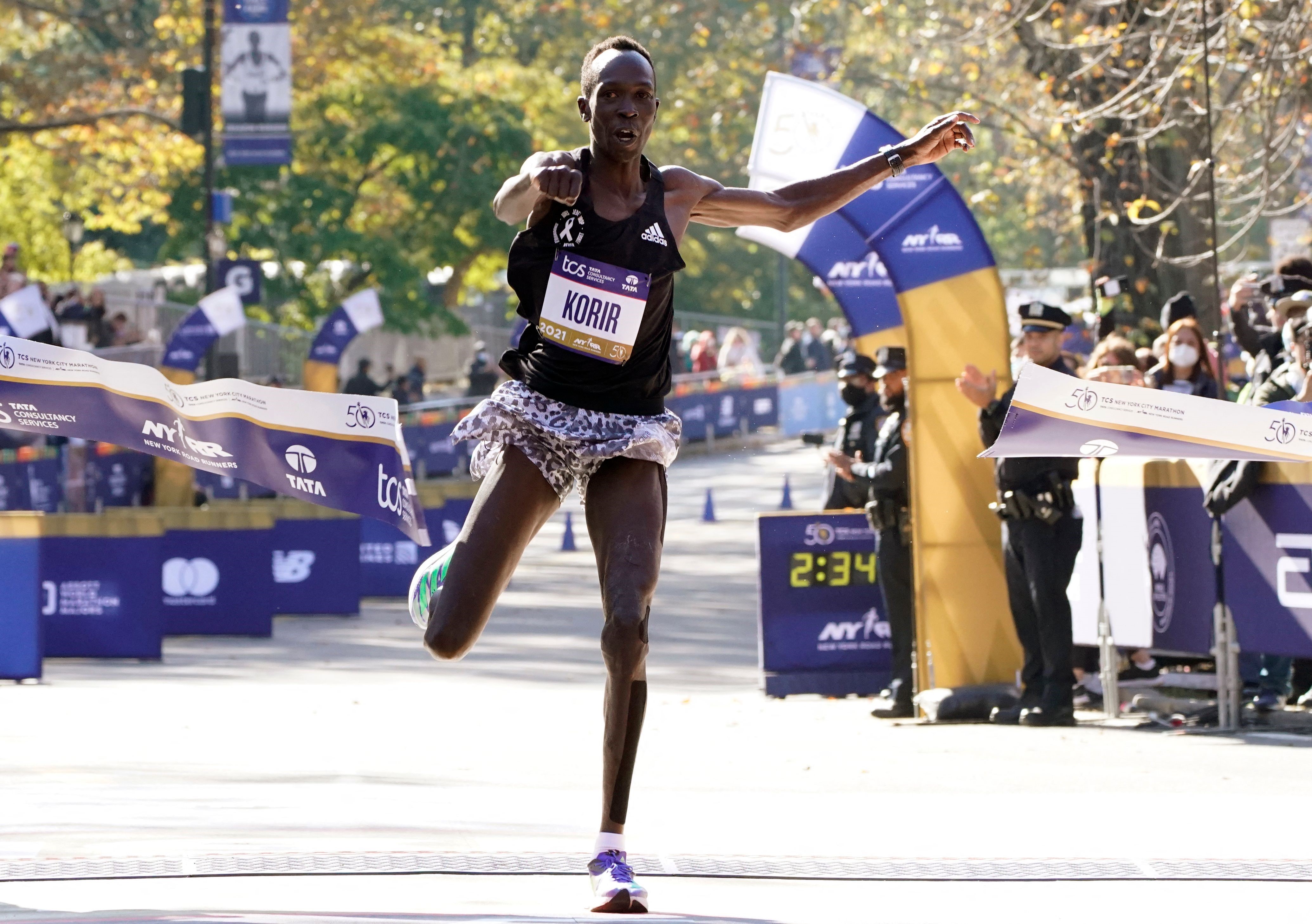 Men's division winner Albert Korir of Kenya crosses the finish line during the 2021 TCS New York City Marathon in New York on November 7, 2021. - After a forced break in 2020, the New York City Marathon is back on for its 50th edition, and with it the cou