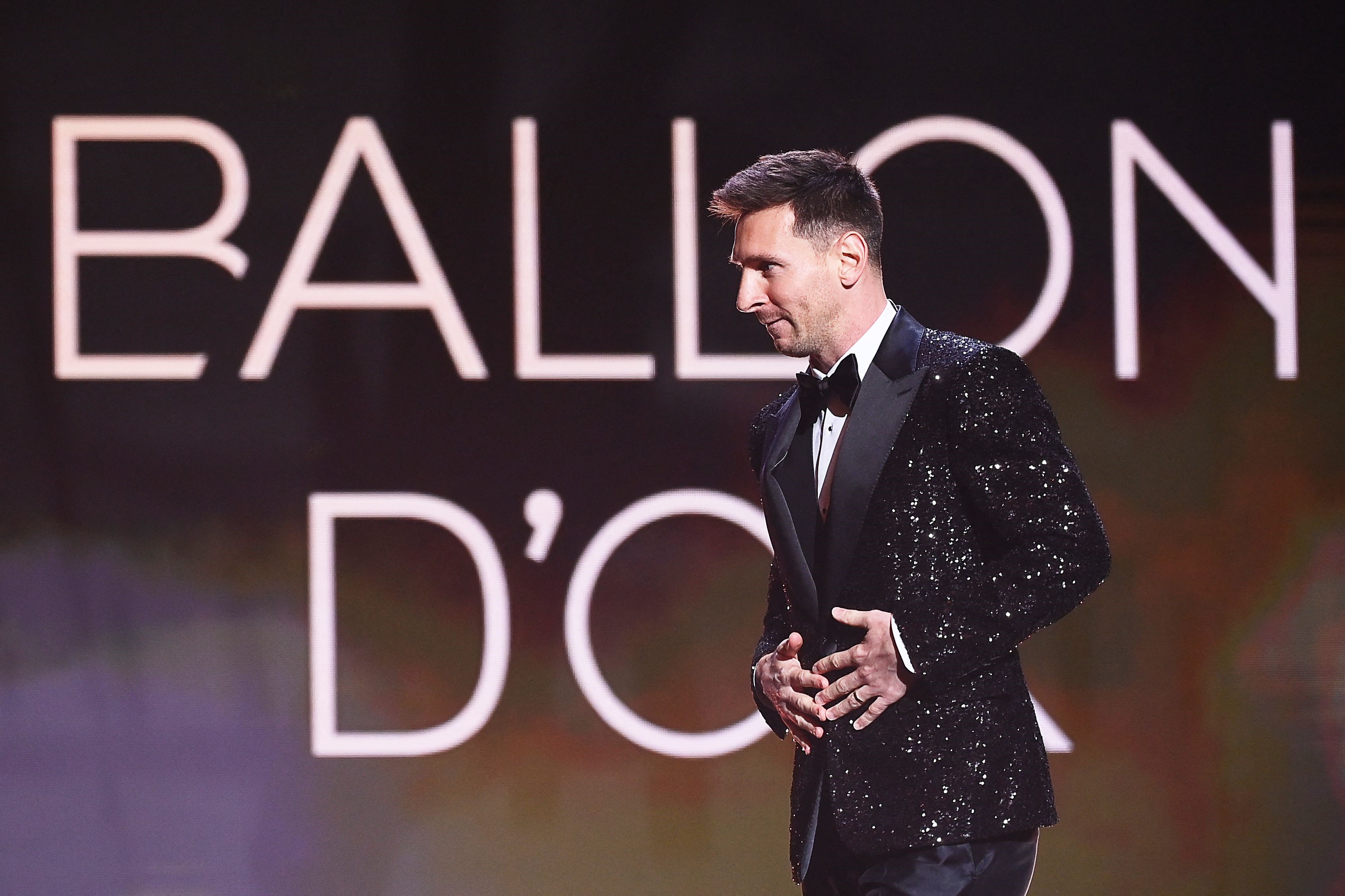 Paris Saint-Germain's Argentine forward Lionel Messi arrives to deliver a speech after being awarded the Ballon d'Or award during the 2021 Ballon d'Or France Football award ceremony at the Theatre du Chatelet in Paris on November 29, 2021